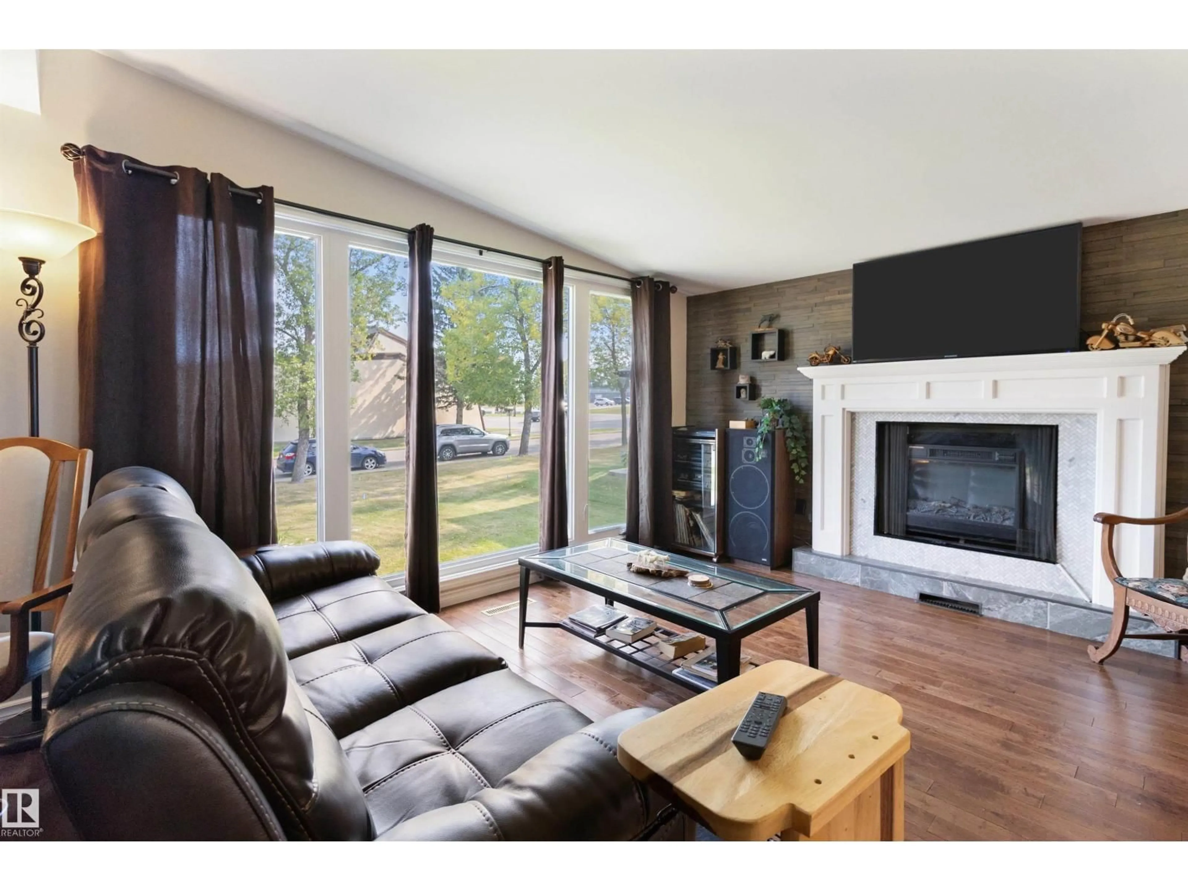Living room with furniture, wood/laminate floor for 61 SPRUCE AV, Sherwood Park Alberta T8A2B7