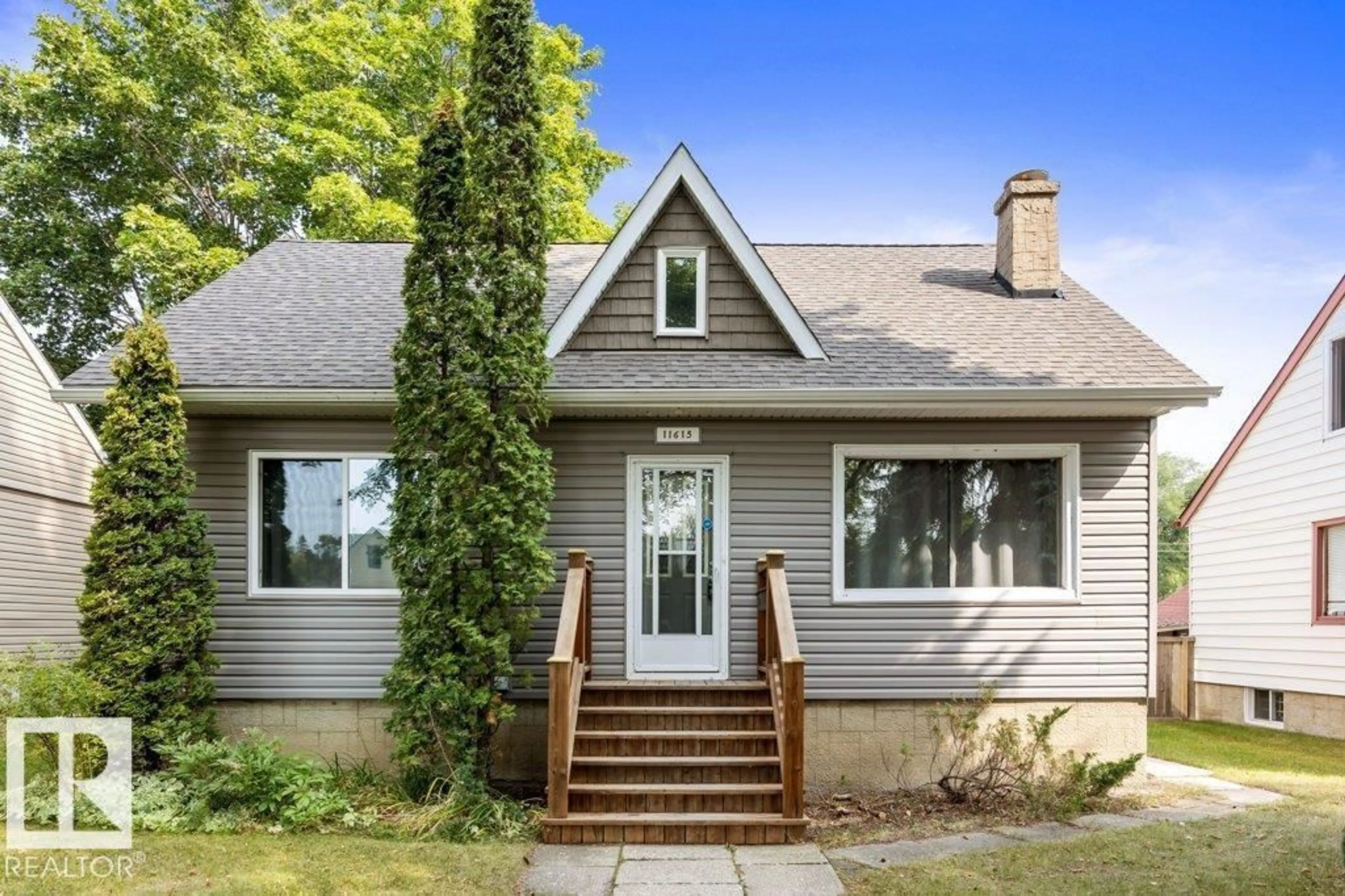 Home with vinyl exterior material, street for NW - 11615 69 ST, Edmonton Alberta T5B1S1