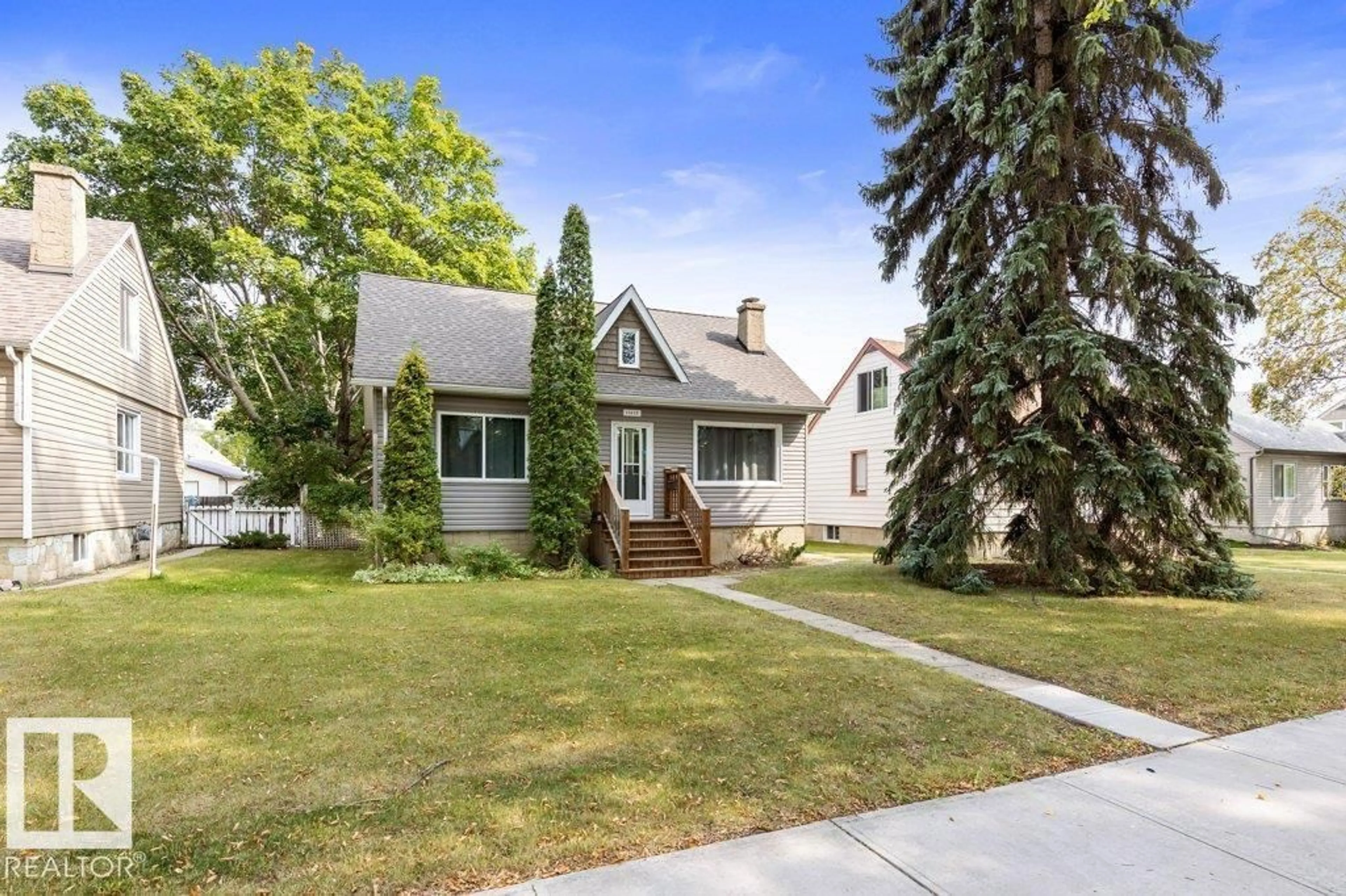 Home with vinyl exterior material, street for NW - 11615 69 ST, Edmonton Alberta T5B1S1