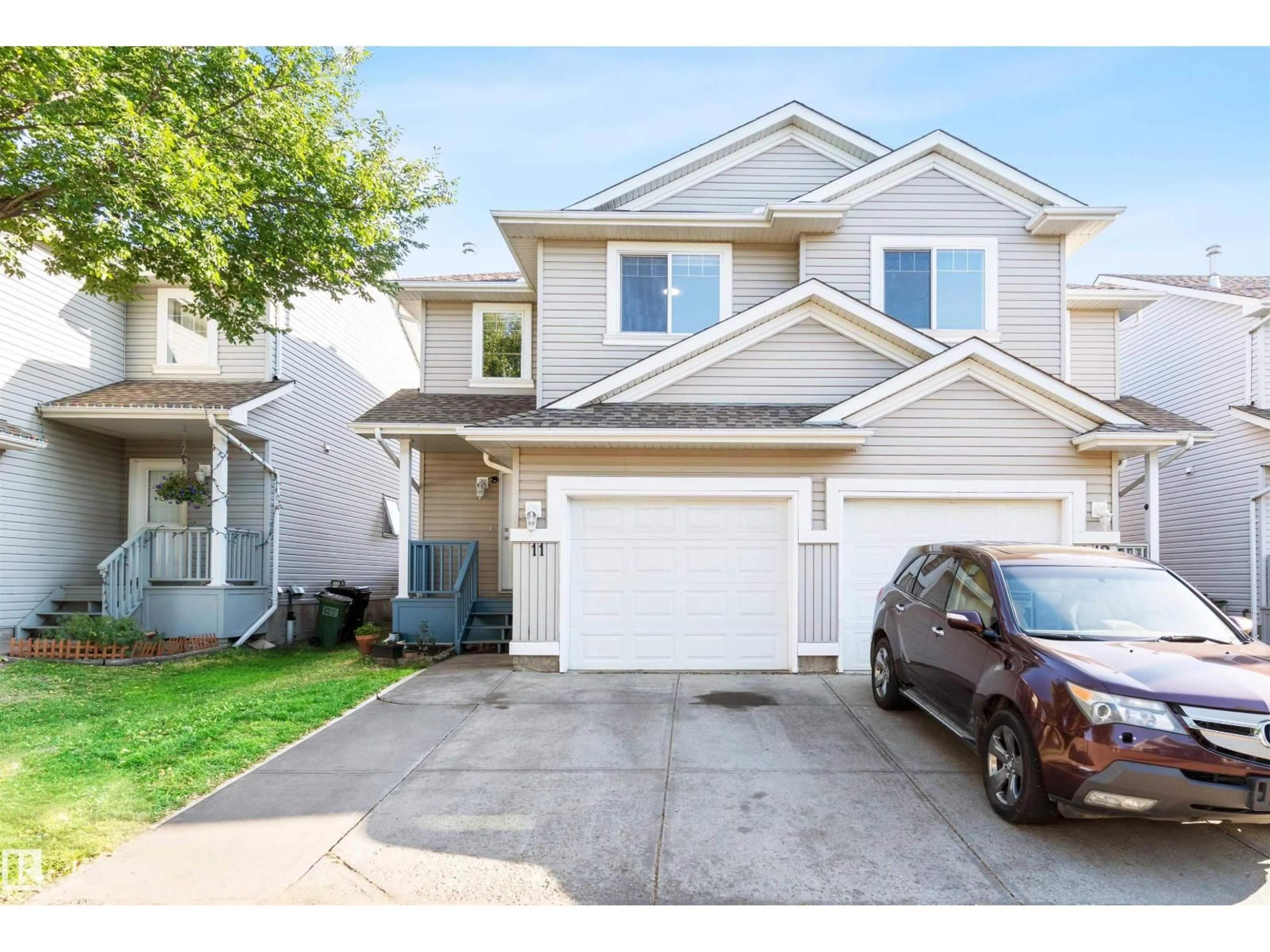 Home with vinyl exterior material, street for 4020 - 11 21 ST, Edmonton Alberta T6T1T8