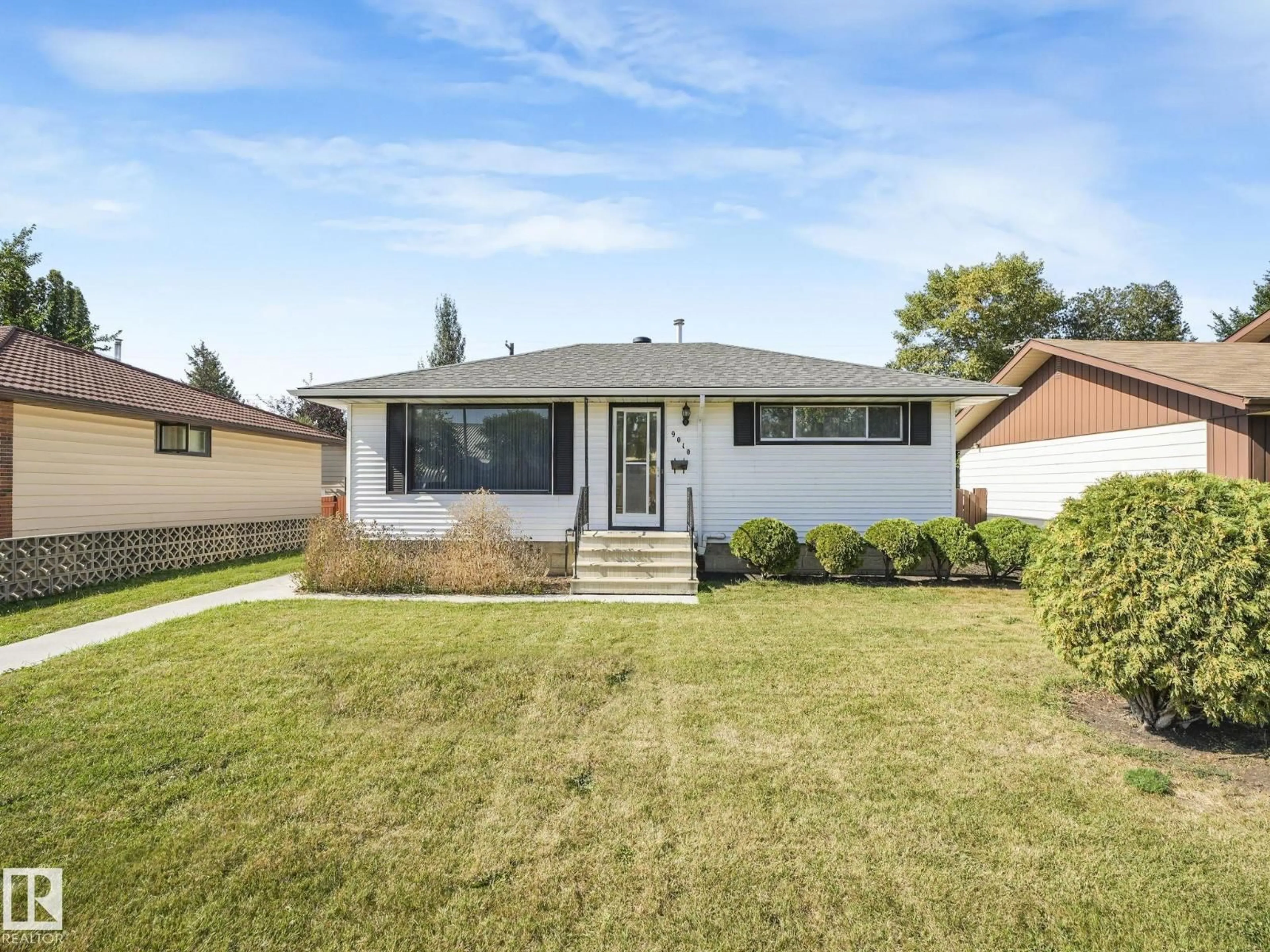 Home with vinyl exterior material, street for 9010 MEADOWLARK RD, Edmonton Alberta T5R5W8