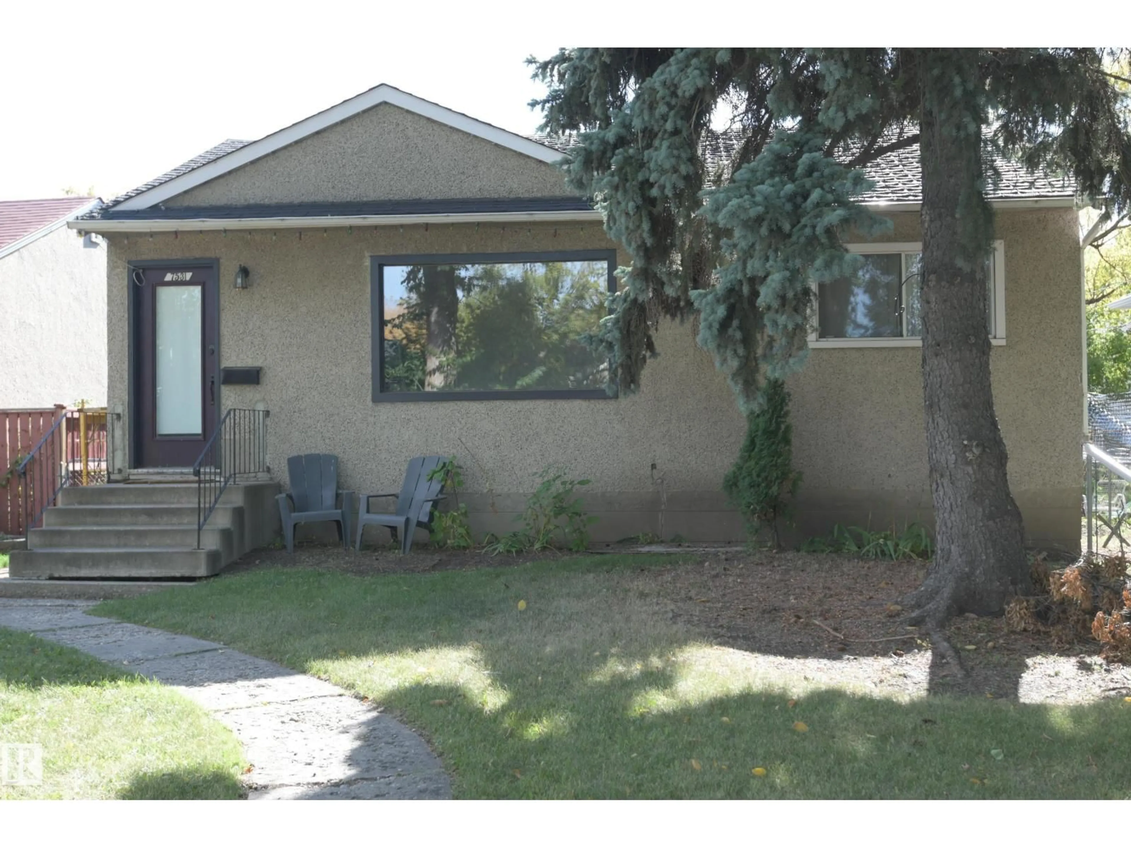 Home with vinyl exterior material, street for 7531 81 AV, Edmonton Alberta T6C0V4