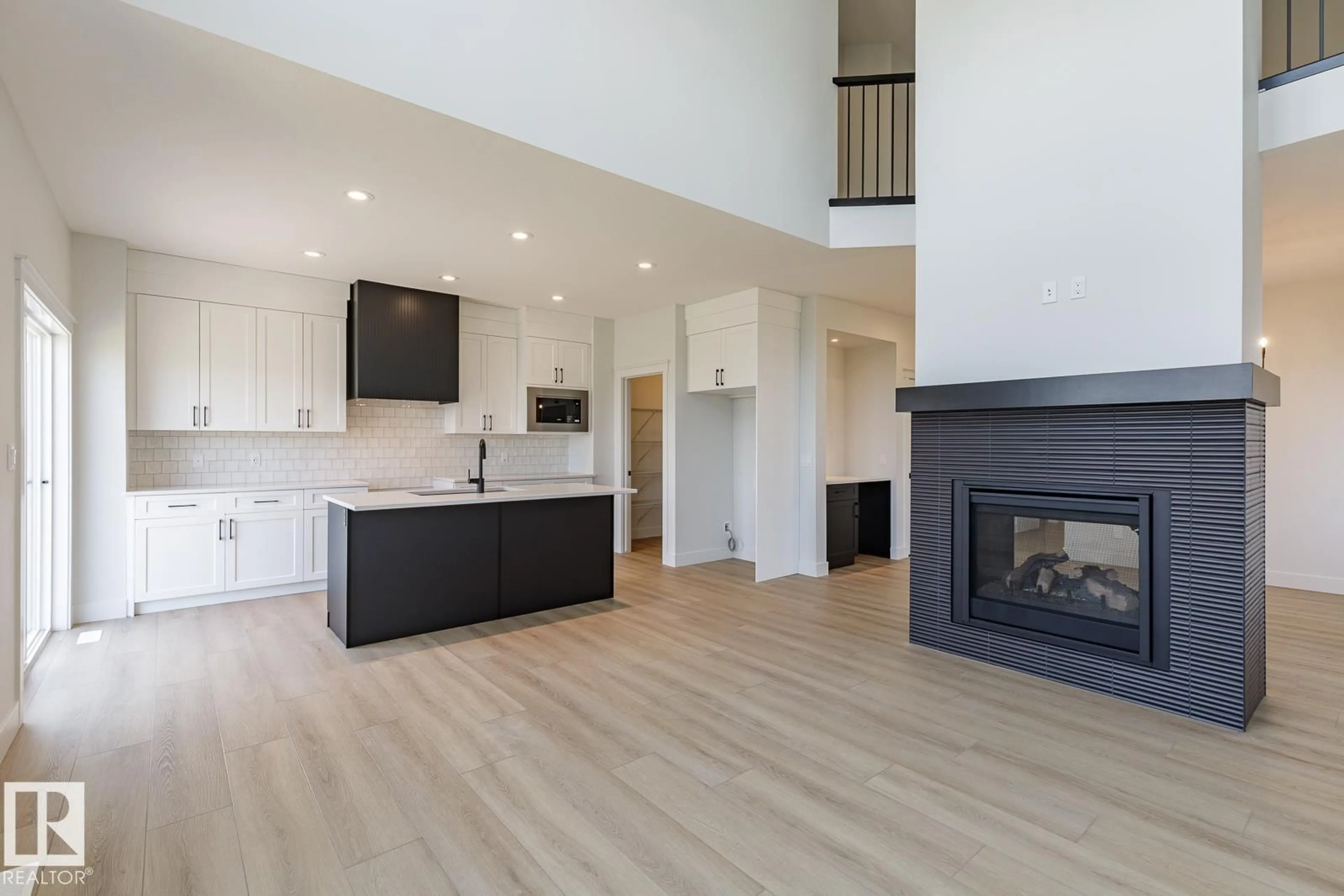 Open concept kitchen, wood/laminate floor for 13113 212A ST, Edmonton Alberta T6W5E1
