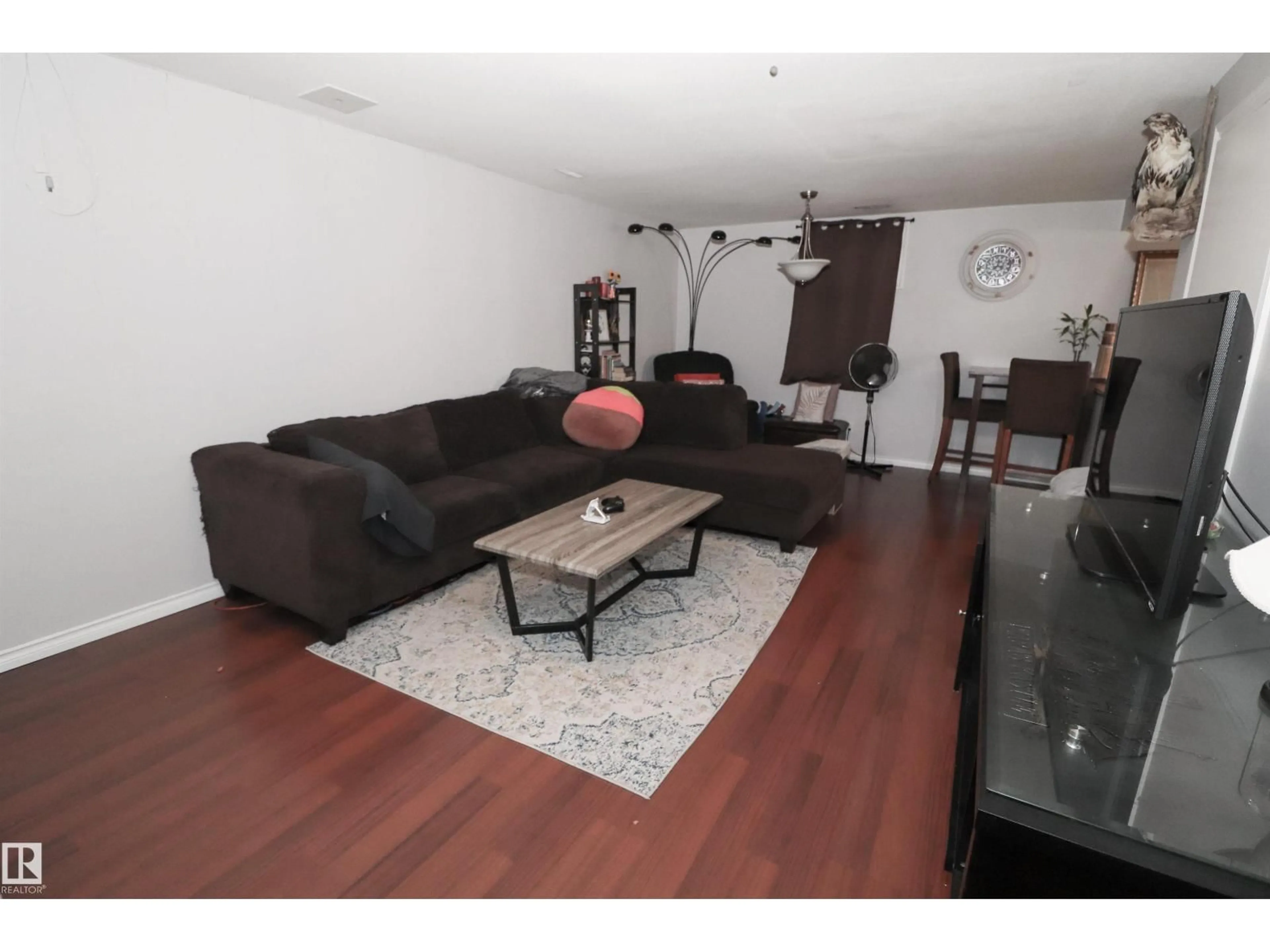Living room with furniture, wood/laminate floor for 2923 89 ST, Edmonton Alberta T6K3A7