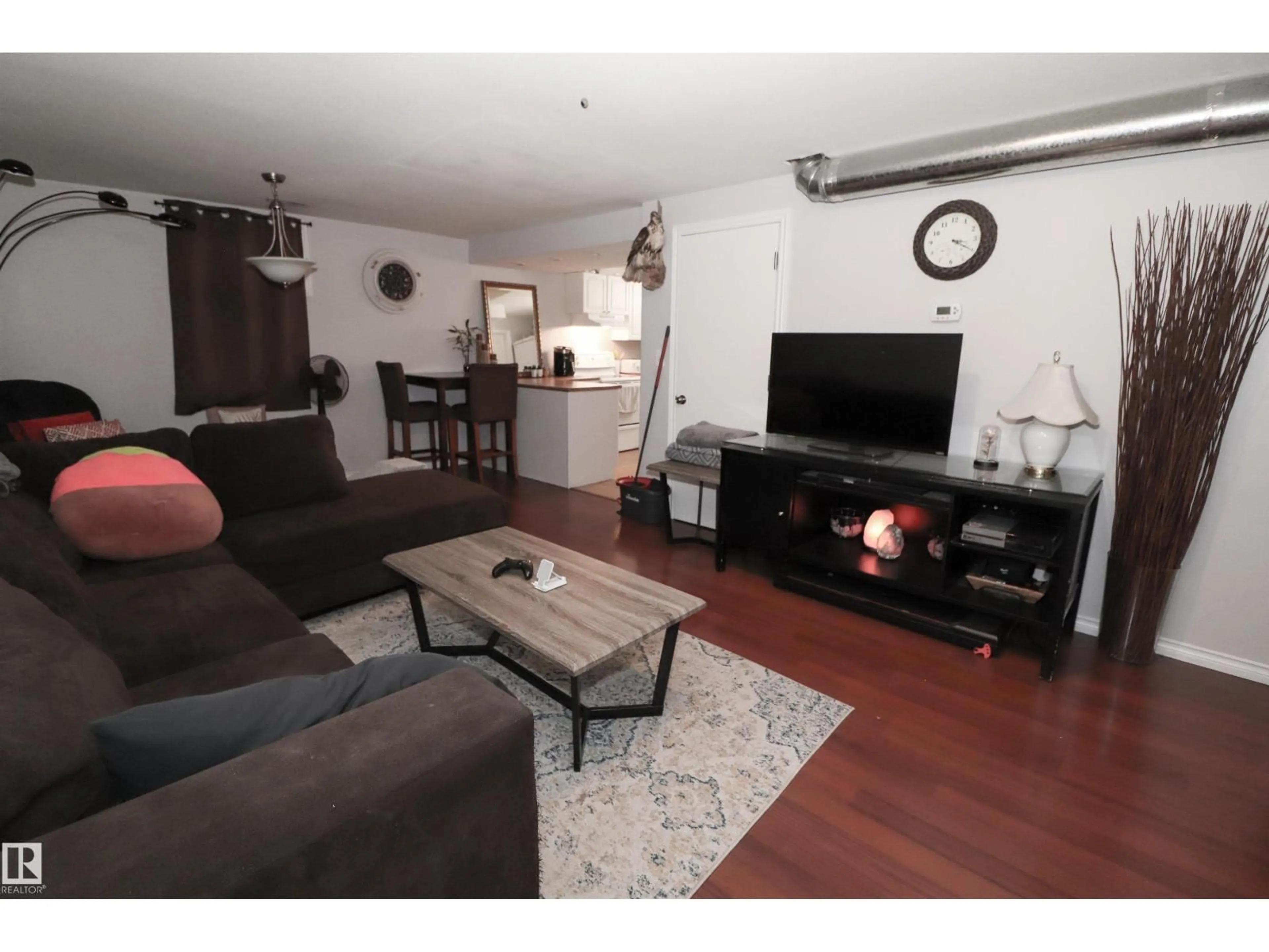 Living room with furniture, wood/laminate floor for 2923 89 ST, Edmonton Alberta T6K3A7