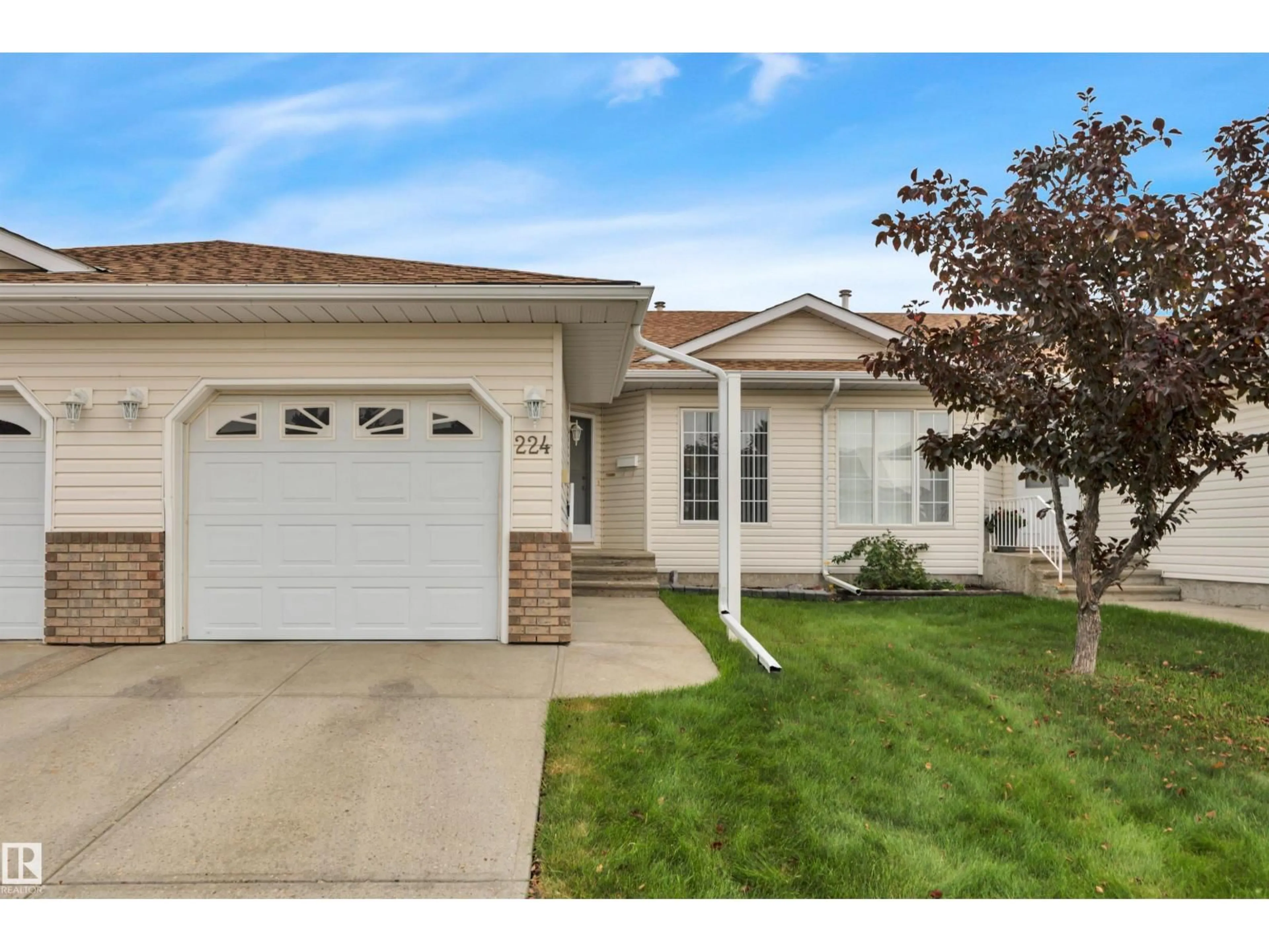 Home with vinyl exterior material, street for 224 RAVINE VI, Leduc Alberta T9E8B9