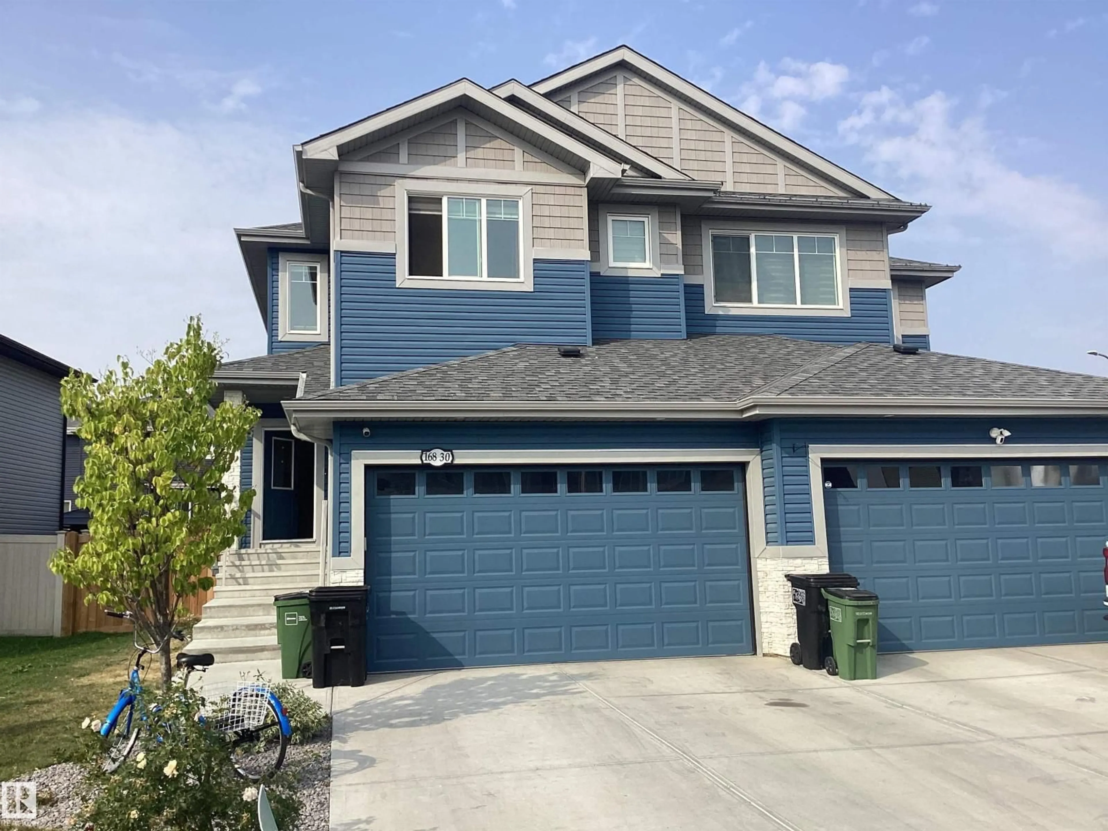 Home with vinyl exterior material, street for NW - 16830 52 ST, Edmonton Alberta T5Y0R9