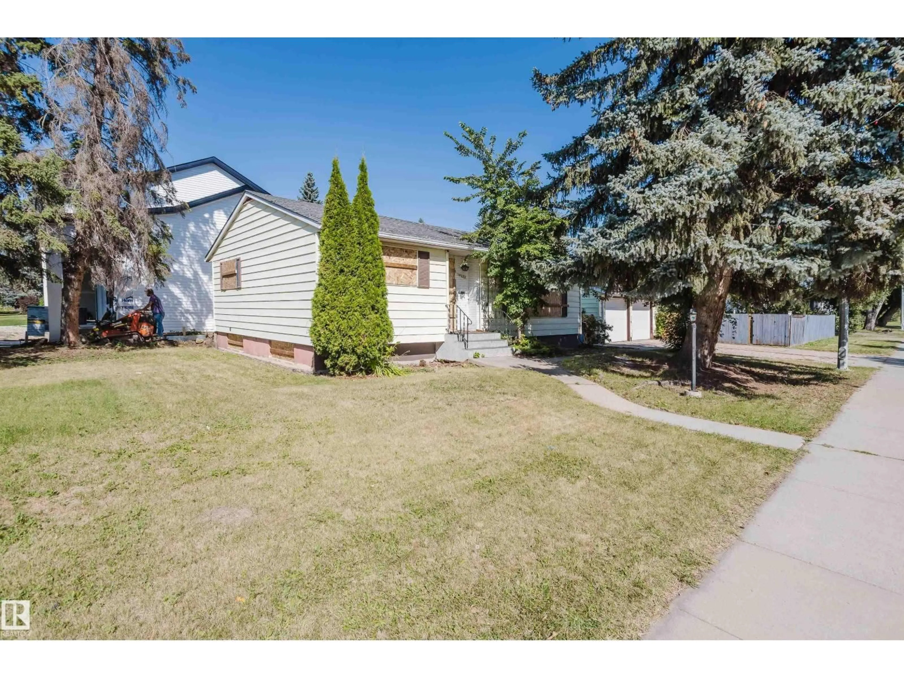 Home with vinyl exterior material, street for 14632 95 AV, Edmonton Alberta T5N0B3