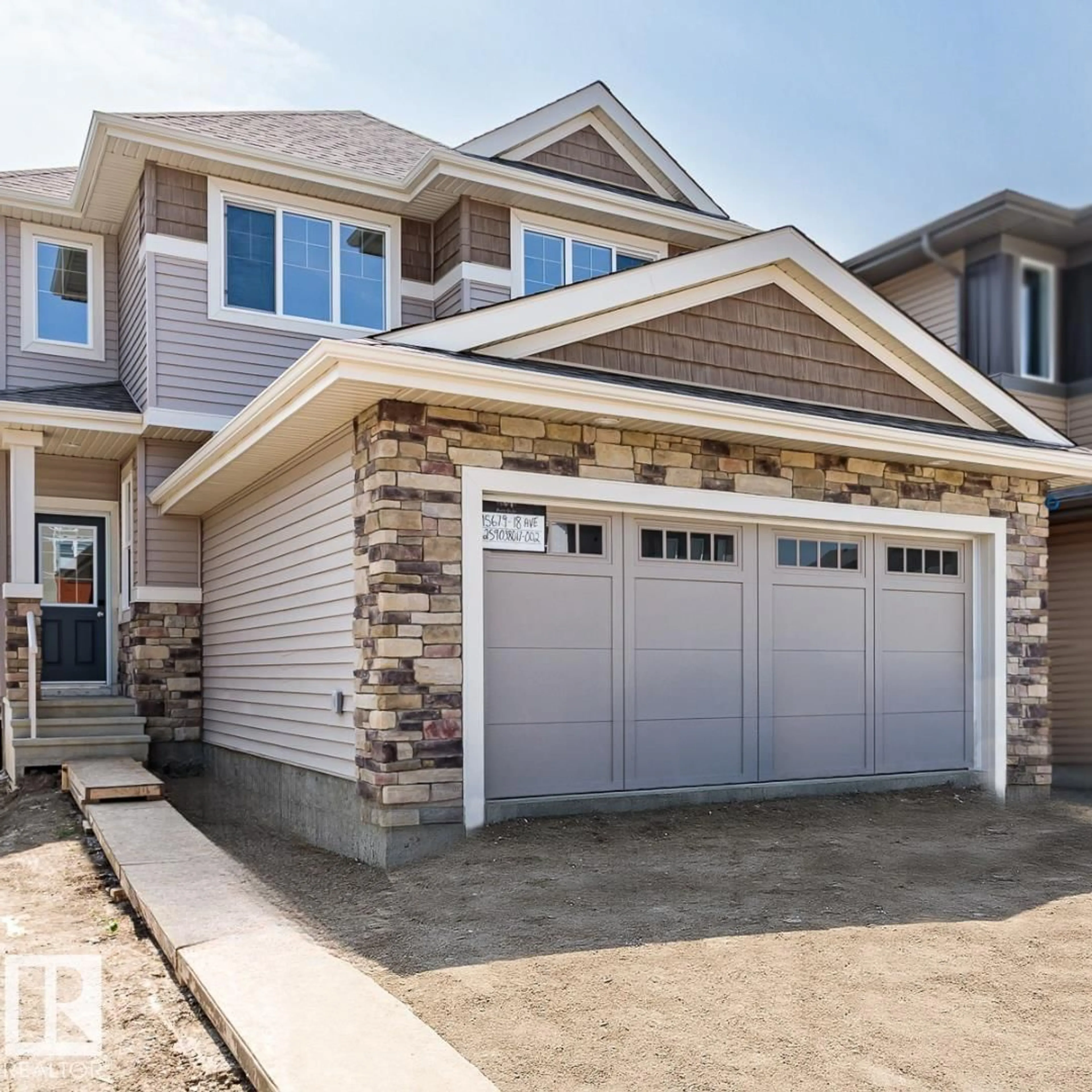 Home with brick exterior material, street for SW - 15679 18 AV, Edmonton Alberta T6W5E1