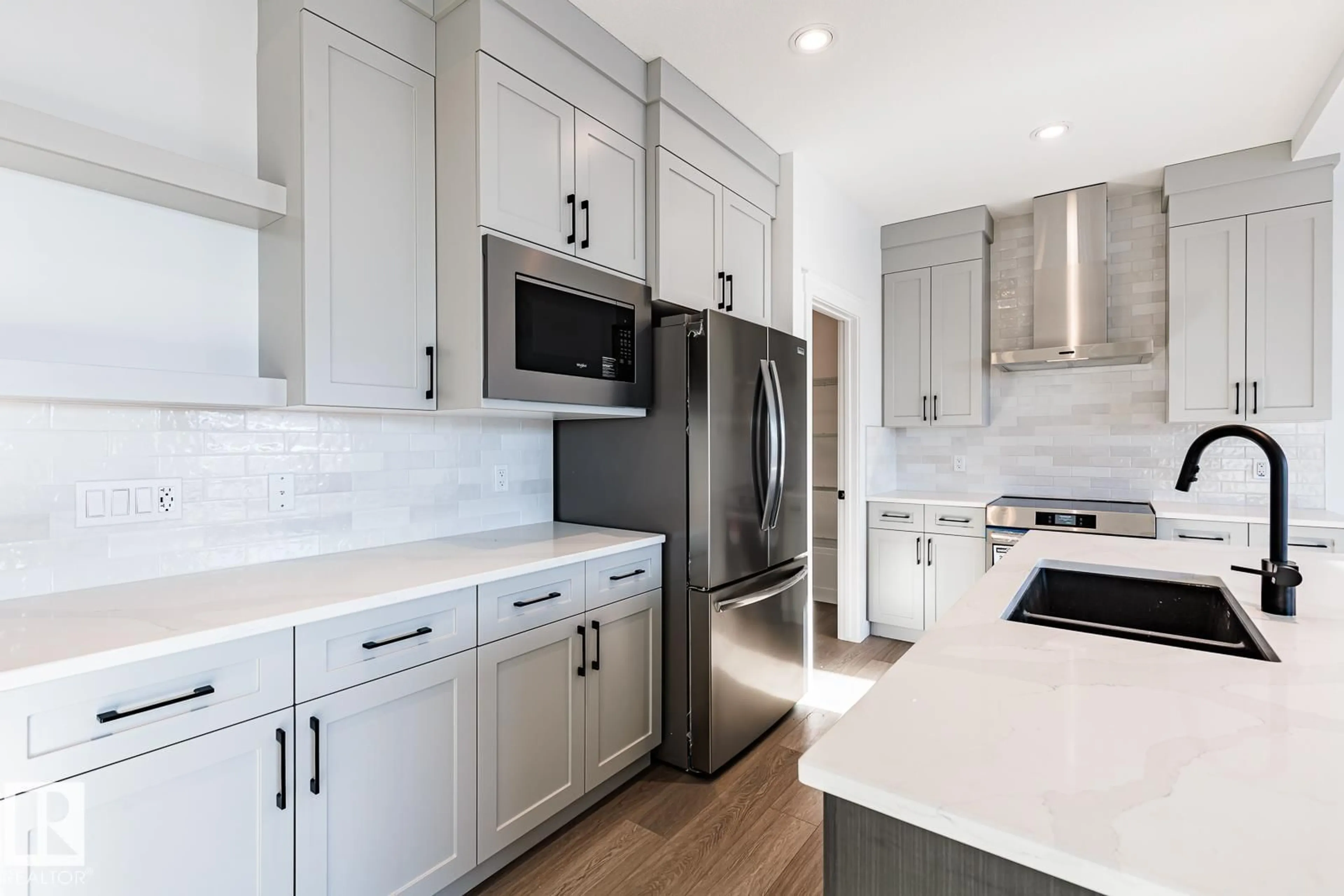 Open concept kitchen, ceramic/tile floor for SW - 15679 18 AV, Edmonton Alberta T6W5E1