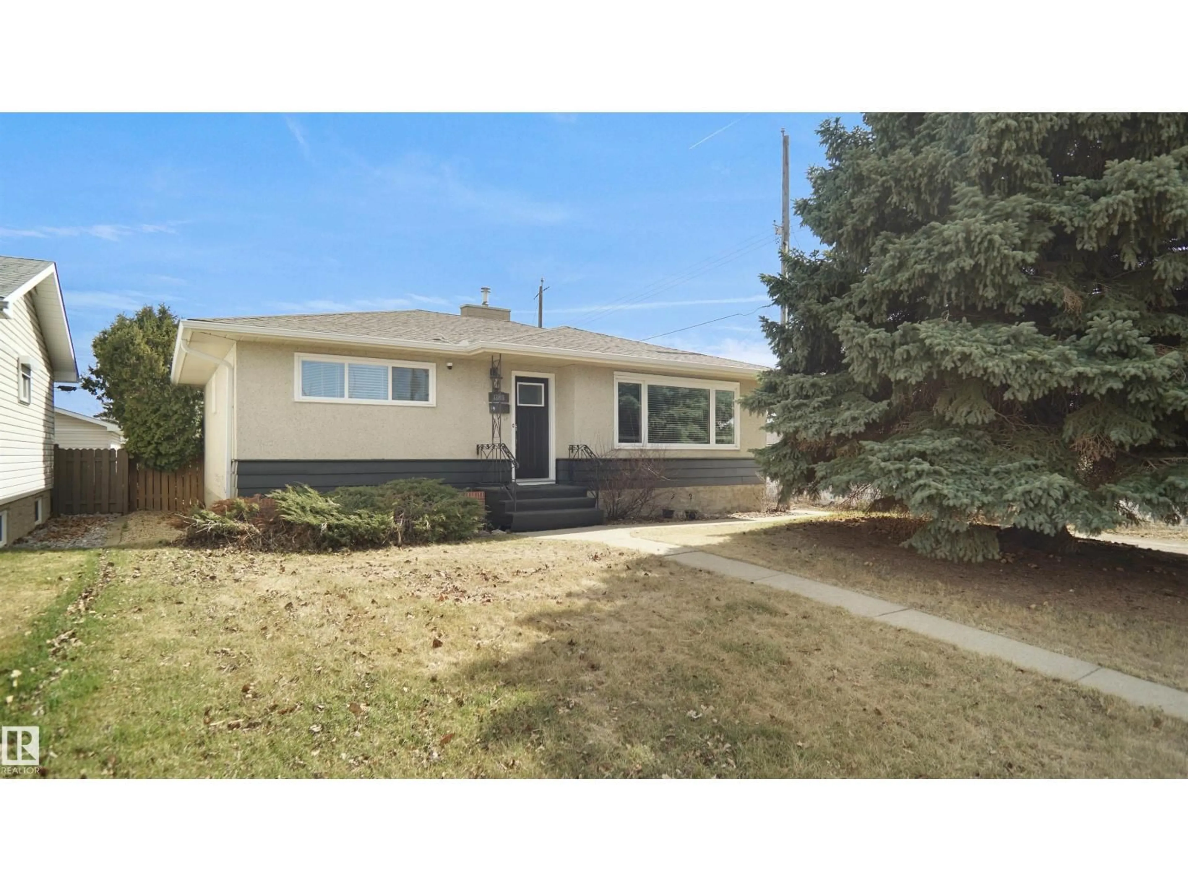 Home with vinyl exterior material, street for NW - 12815 79 ST, Edmonton Alberta T5C1J1