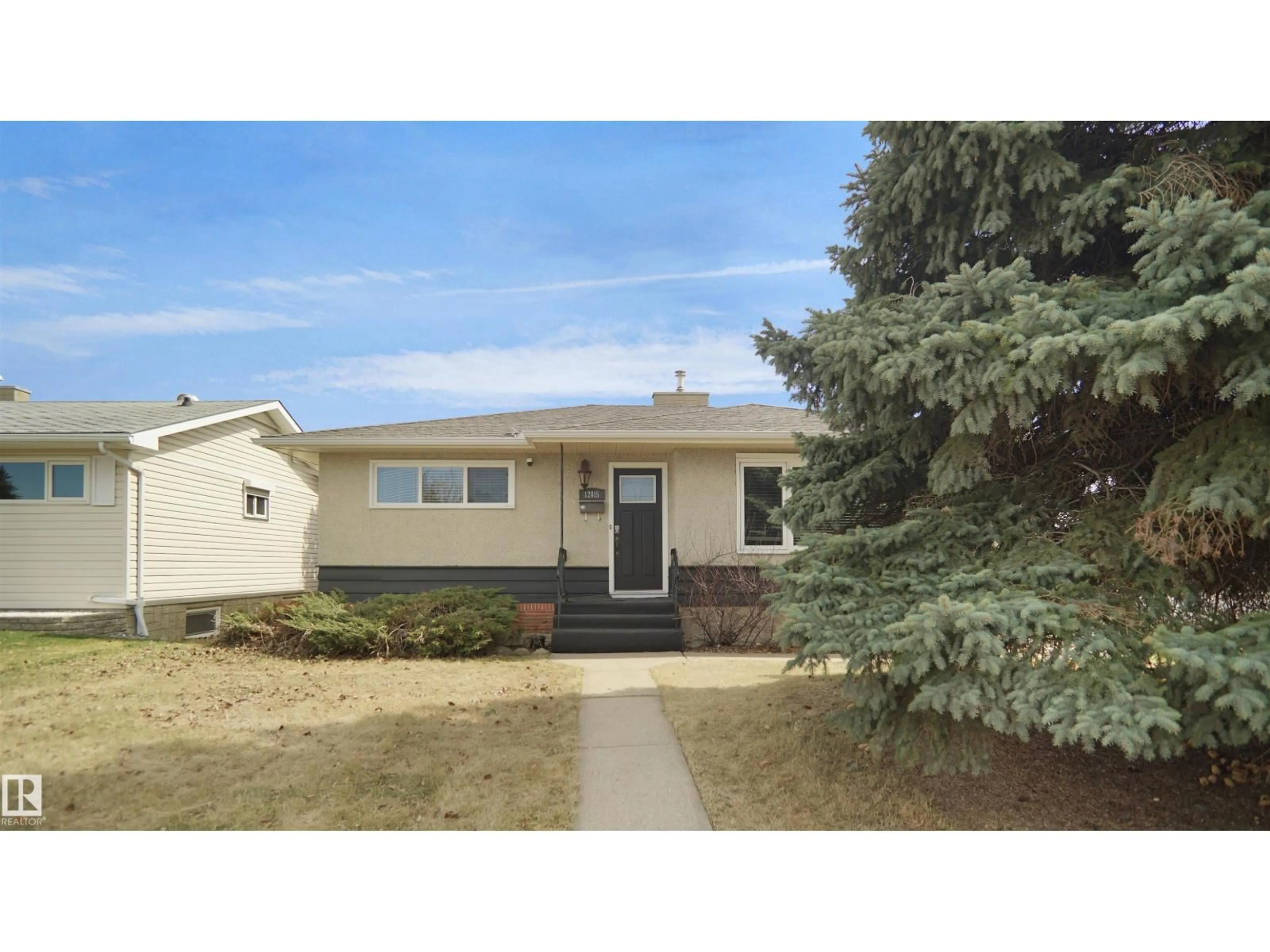 Home with vinyl exterior material, street for NW - 12815 79 ST, Edmonton Alberta T5C1J1