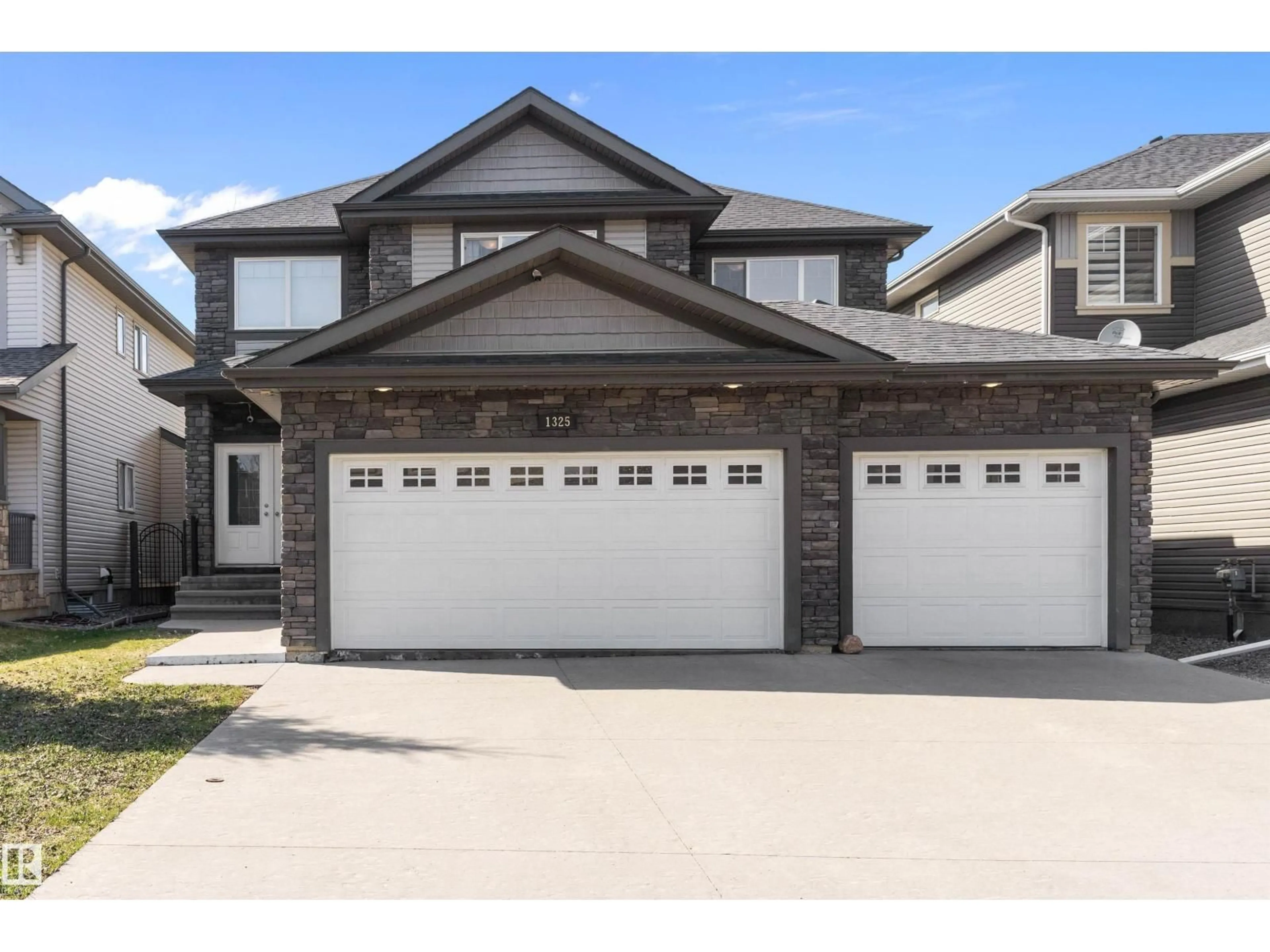 Home with vinyl exterior material, street for 1325 ADAMSON DR, Edmonton Alberta T6W2N8