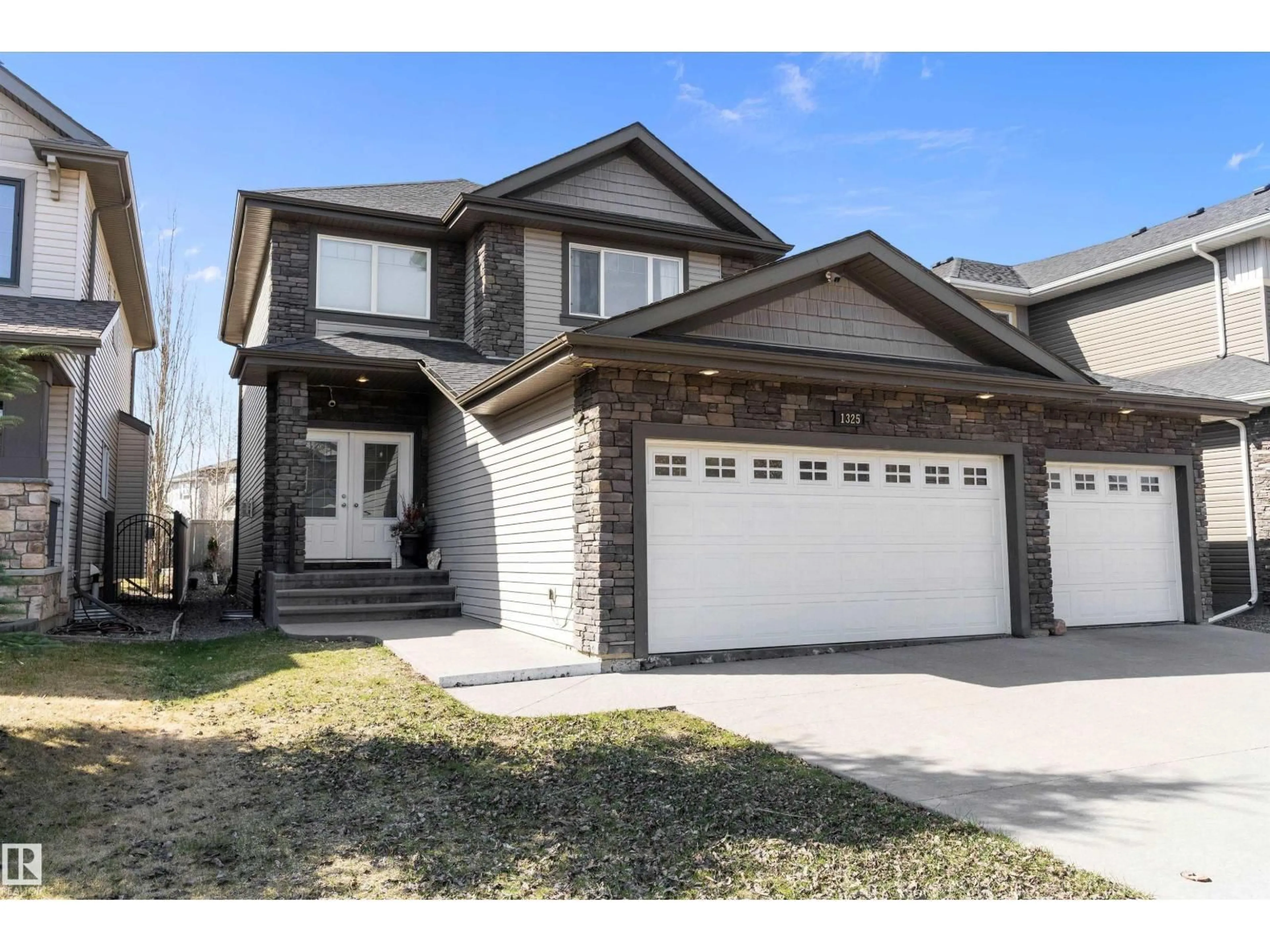 Home with vinyl exterior material, street for 1325 ADAMSON DR, Edmonton Alberta T6W2N8