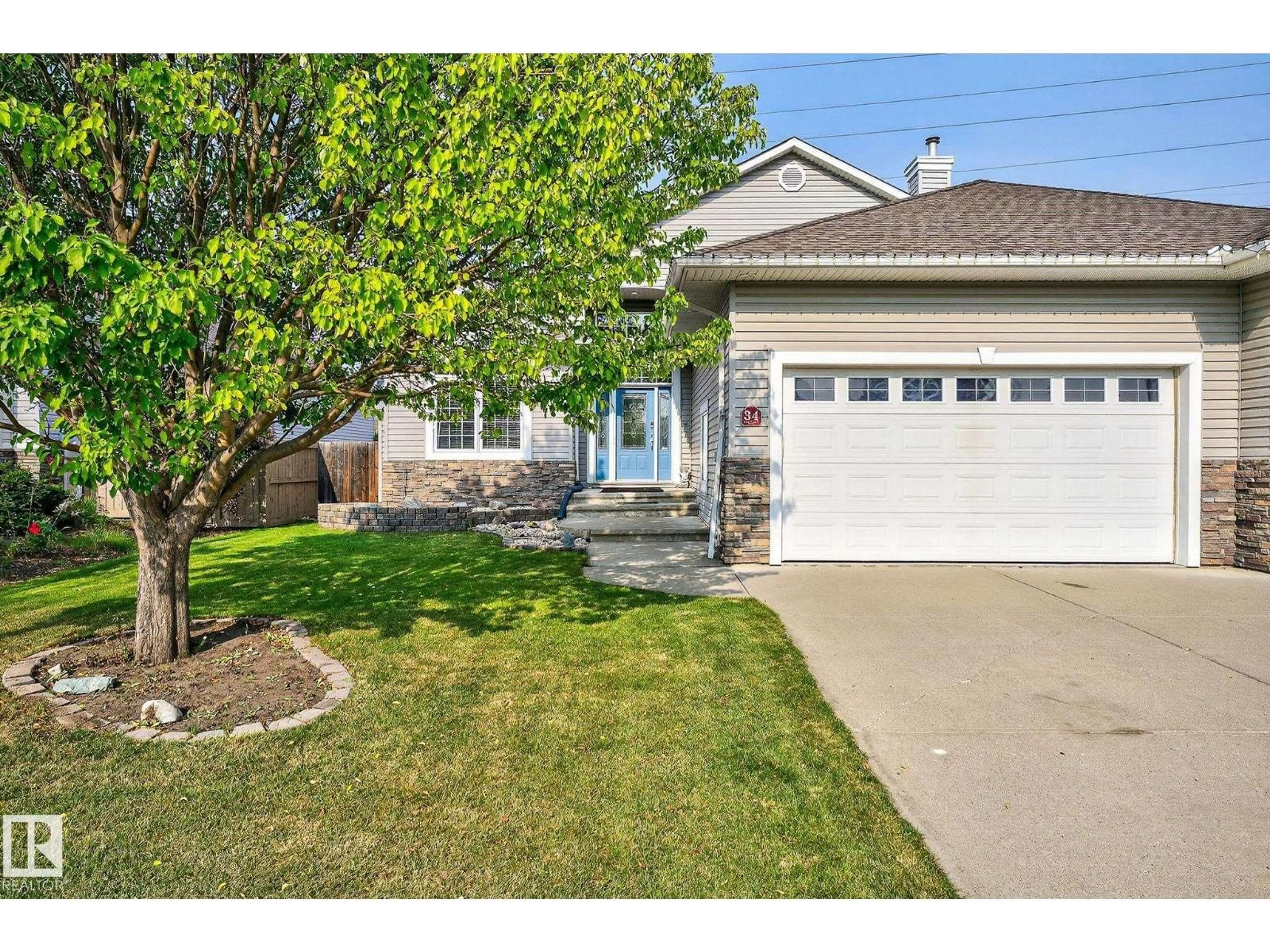 Home with vinyl exterior material, street for 34 VALLEYVIEW RG, Fort Saskatchewan Alberta T8L4P2