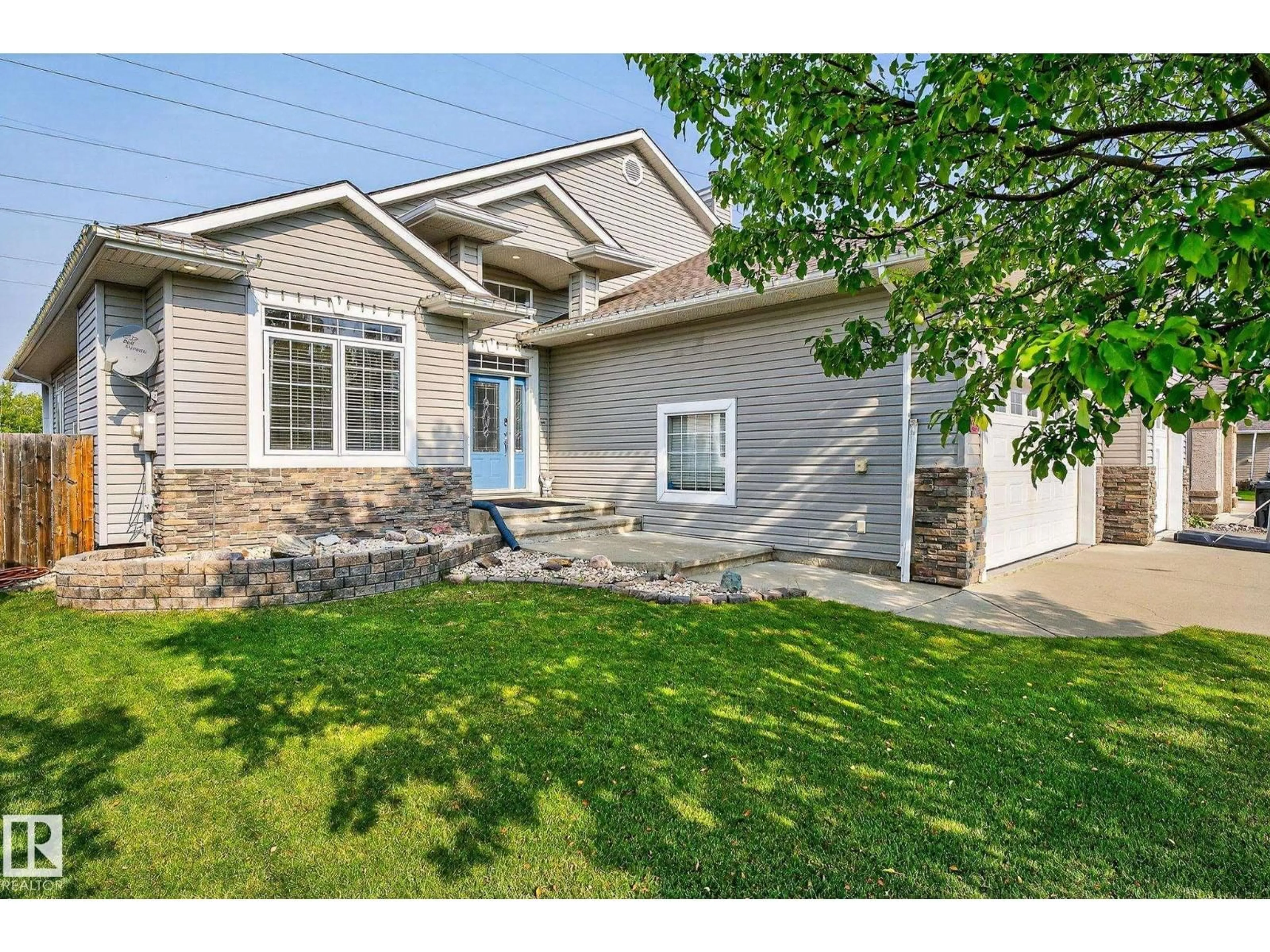 Home with vinyl exterior material, street for 34 VALLEYVIEW RG, Fort Saskatchewan Alberta T8L4P2