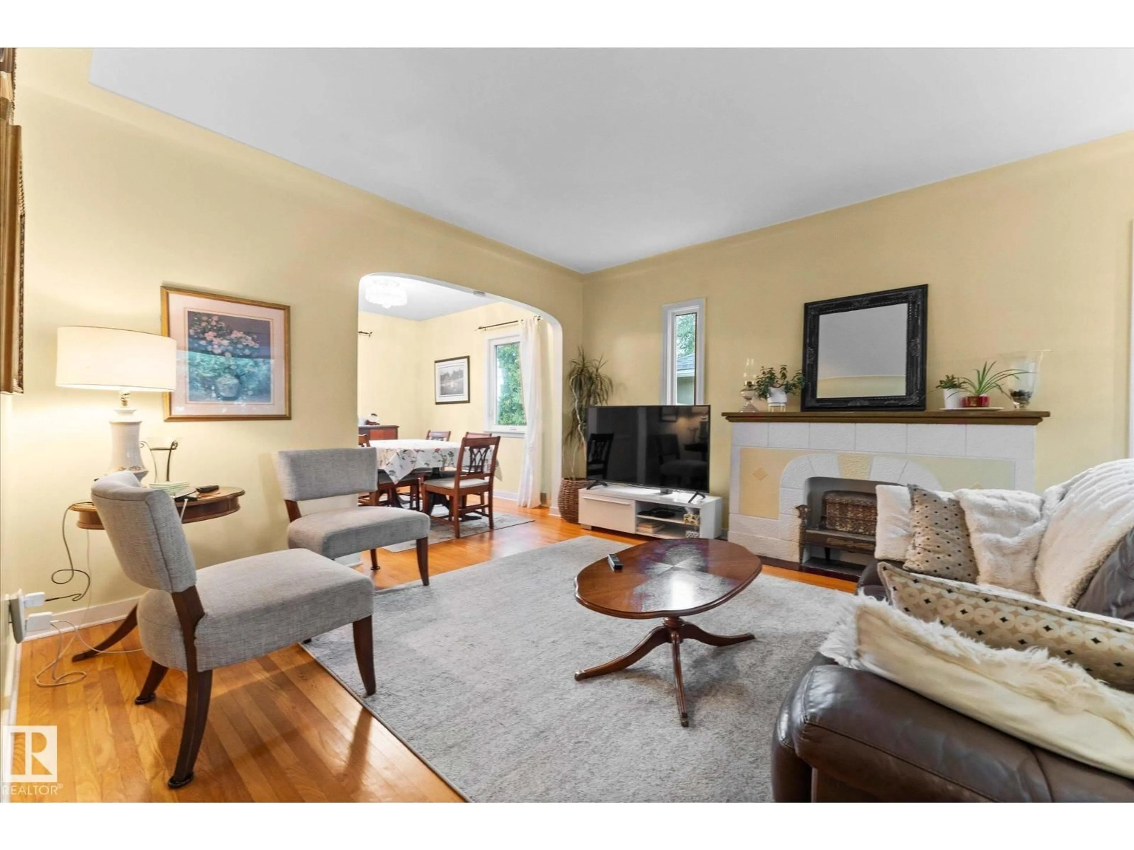 Living room with furniture, wood/laminate floor for 6615 111 AV, Edmonton Alberta T5B0A5