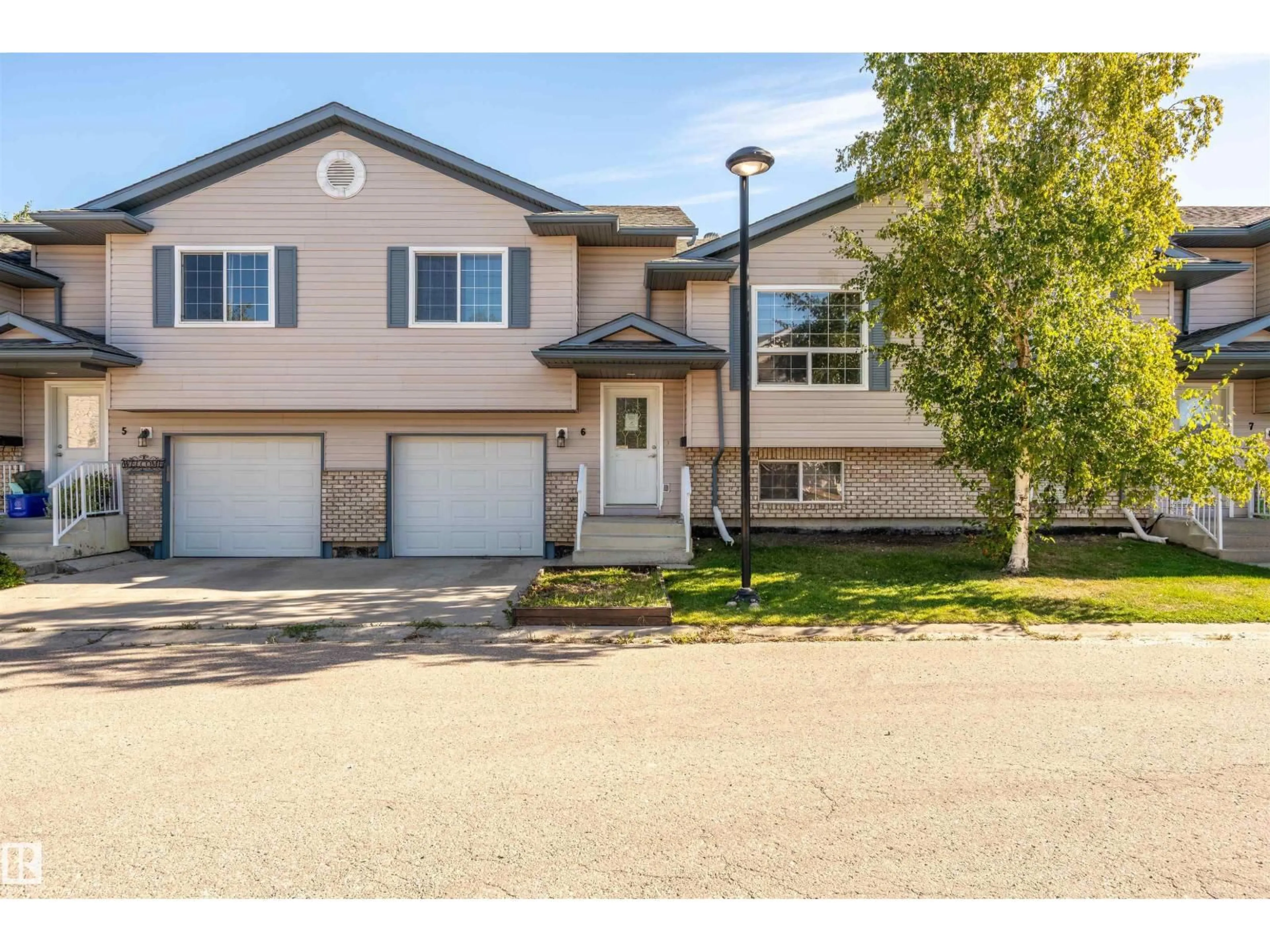 Home with vinyl exterior material, street for #6 - 6506 47 ST, Cold Lake Alberta T9M0C5
