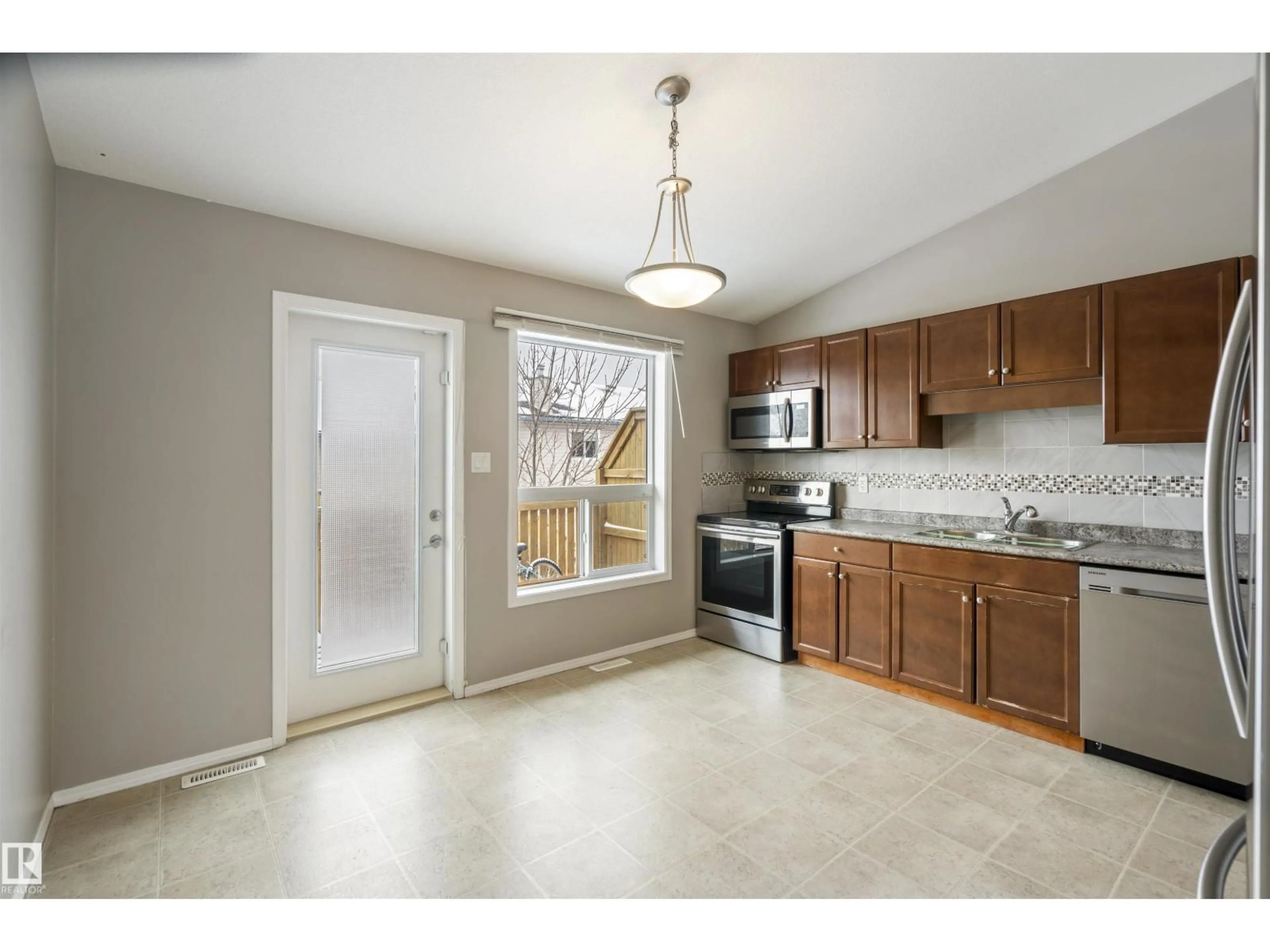 Open concept kitchen, ceramic/tile floor for #6 - 6506 47 ST, Cold Lake Alberta T9M0C5