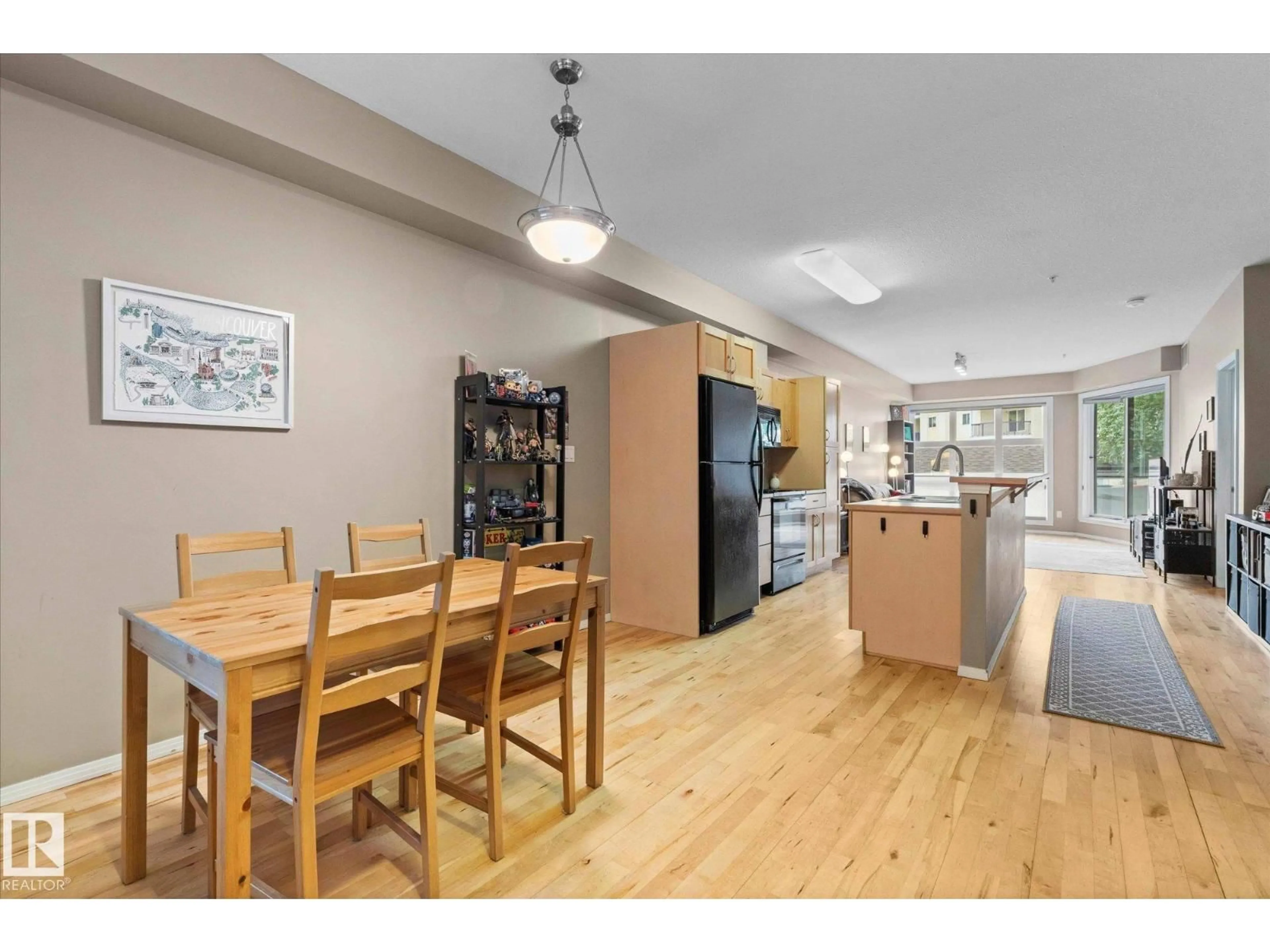 Open concept kitchen, wood/laminate floor for #107 - 11933 106 AV, Edmonton Alberta T5H0S2