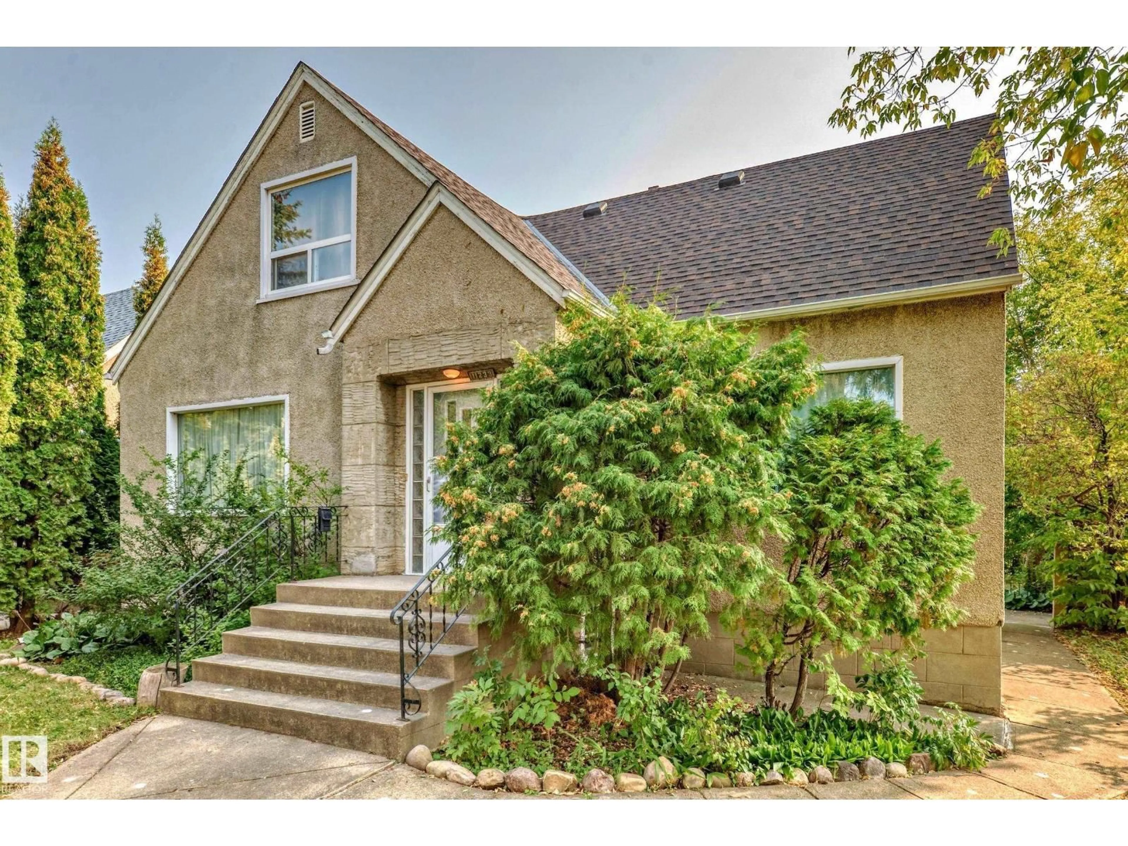 Home with brick exterior material, street for 11233 95 ST, Edmonton Alberta T5G1K8
