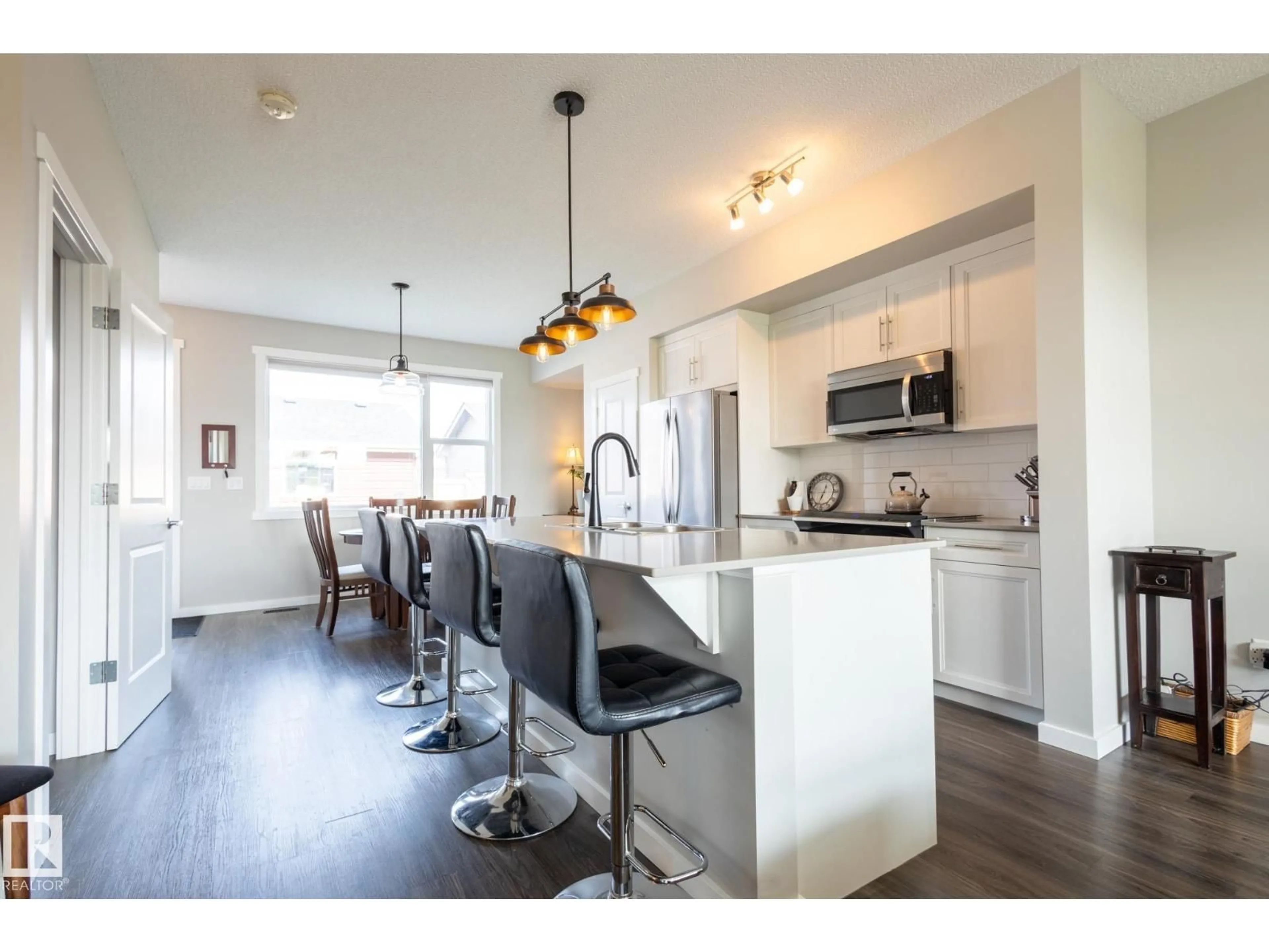Open concept kitchen, wood/laminate floor for 2294 GLENRIDDING BV, Edmonton Alberta T6W3P5