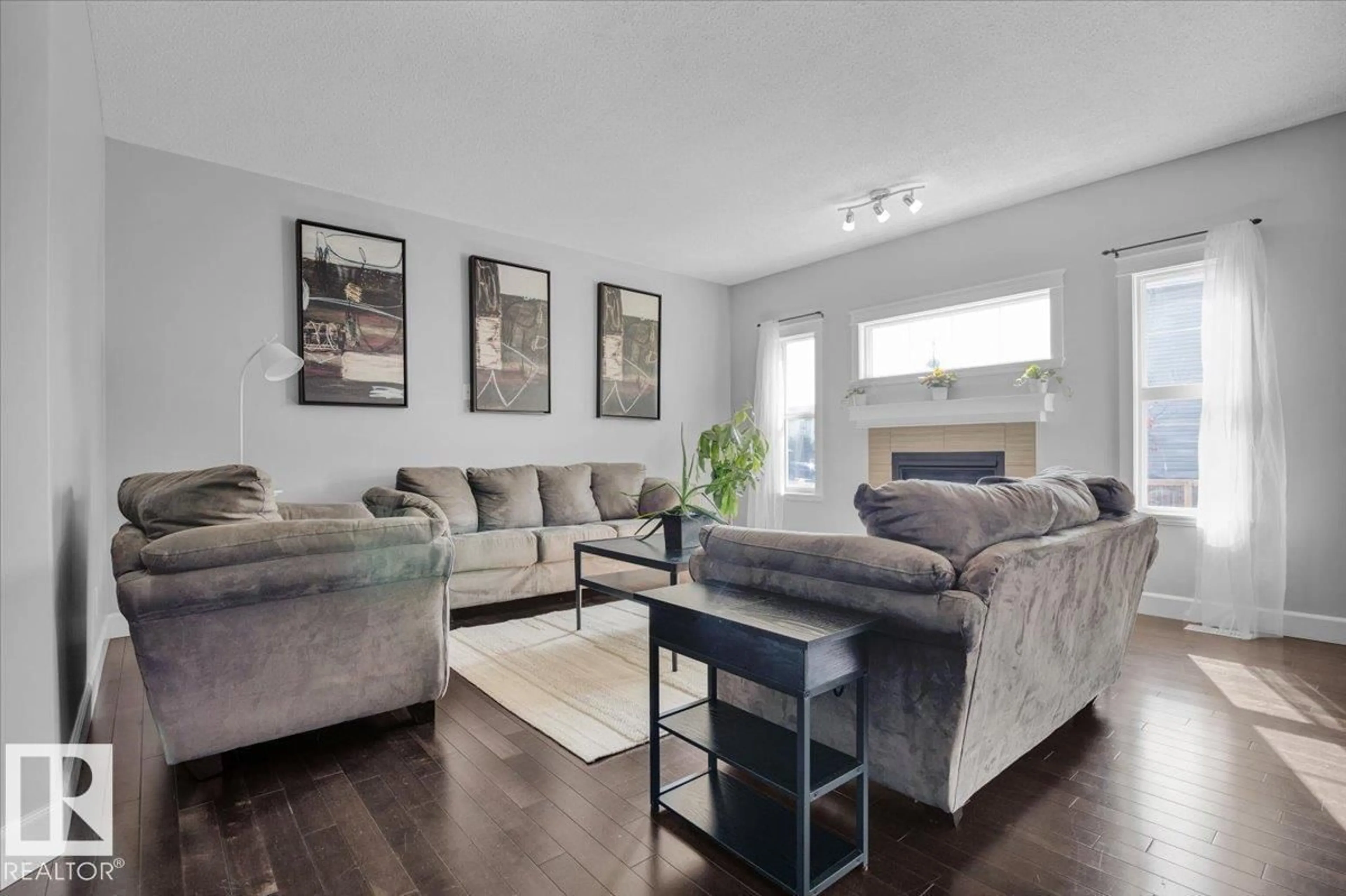 Living room with furniture, wood/laminate floor for NW - 17028 78 ST, Edmonton Alberta T5Z0E6