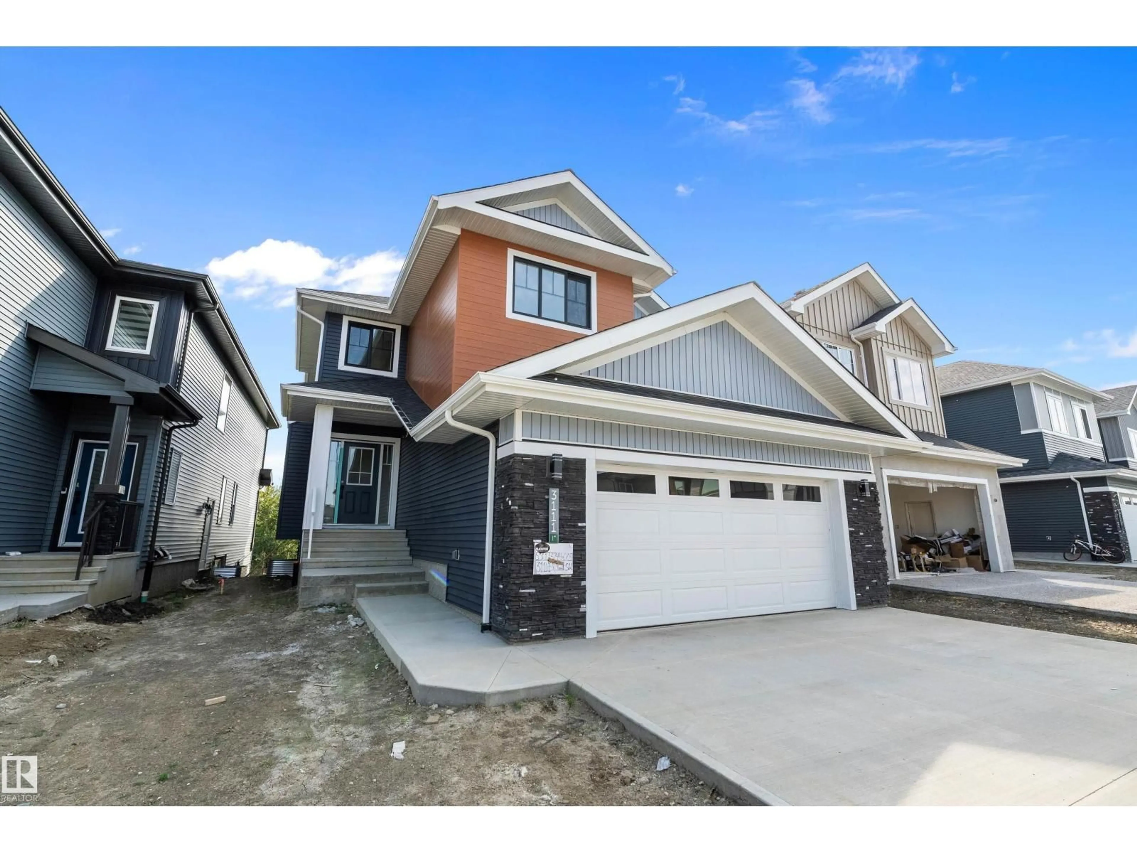 Home with vinyl exterior material, street for 3111 158 ST, Edmonton Alberta T6W5C9