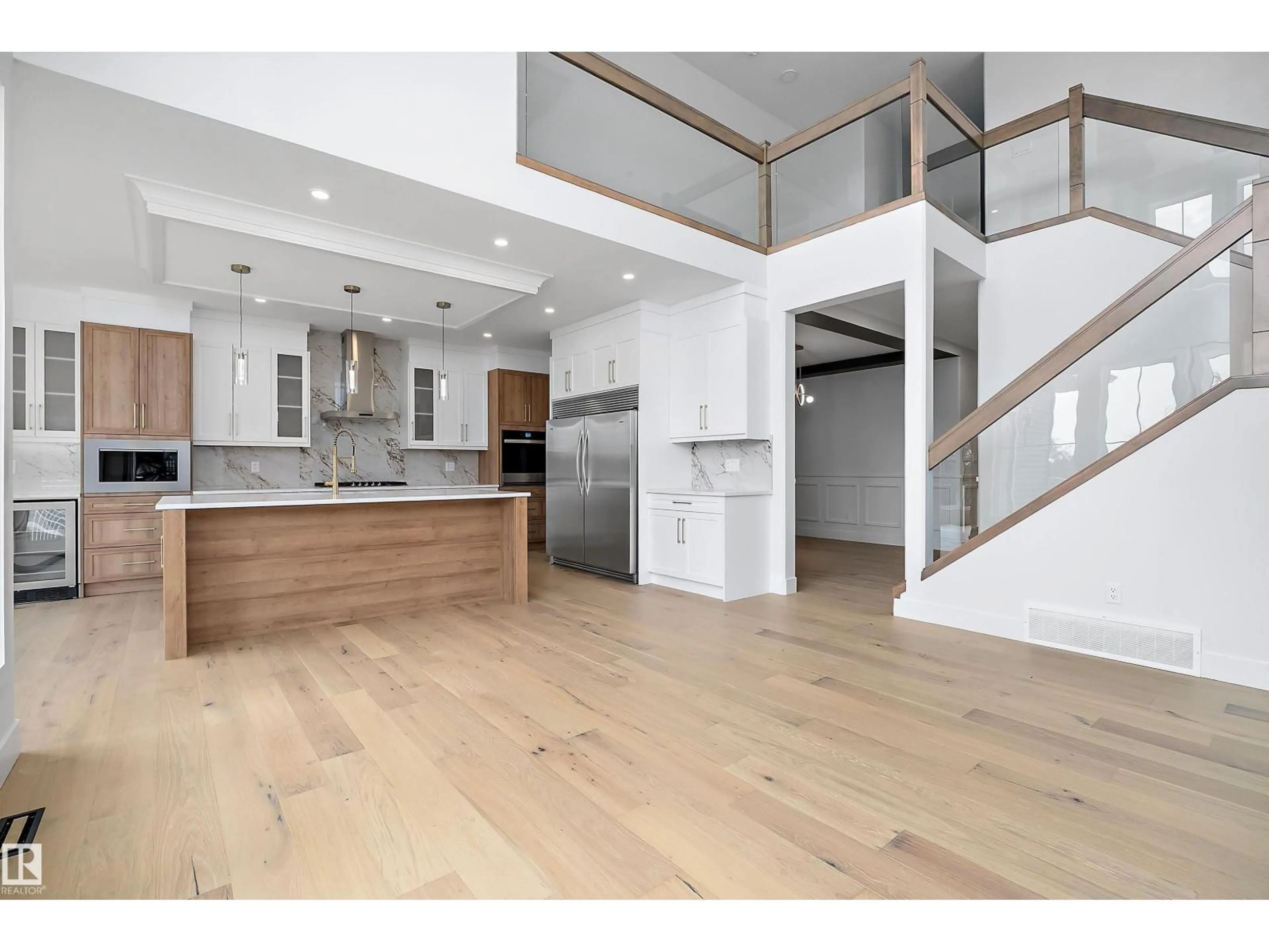 Open concept kitchen, wood/laminate floor for 3111 158 ST, Edmonton Alberta T6W5C9
