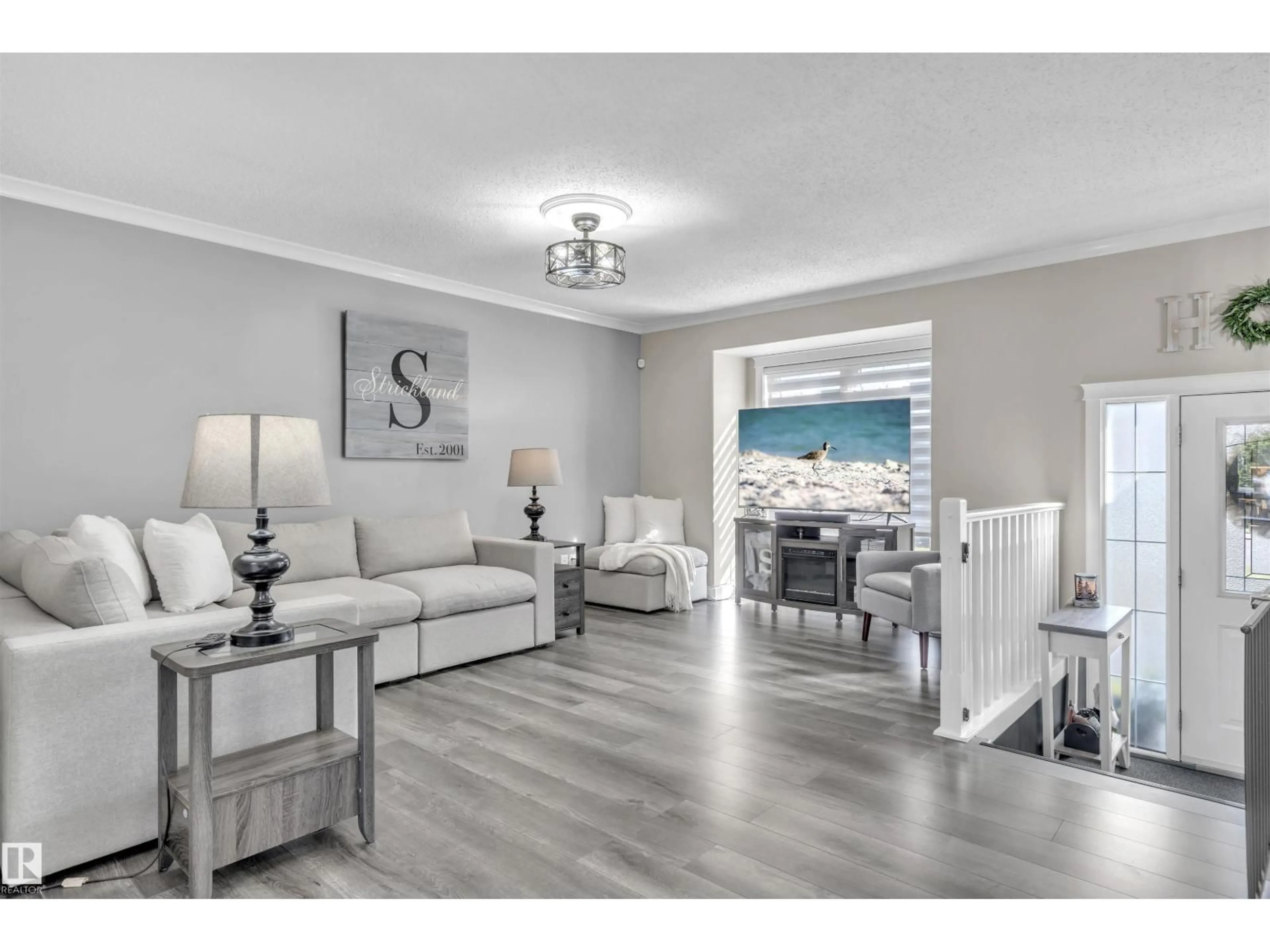 Living room with furniture, wood/laminate floor for 6018 54 AV, Cold Lake Alberta T9M1V5