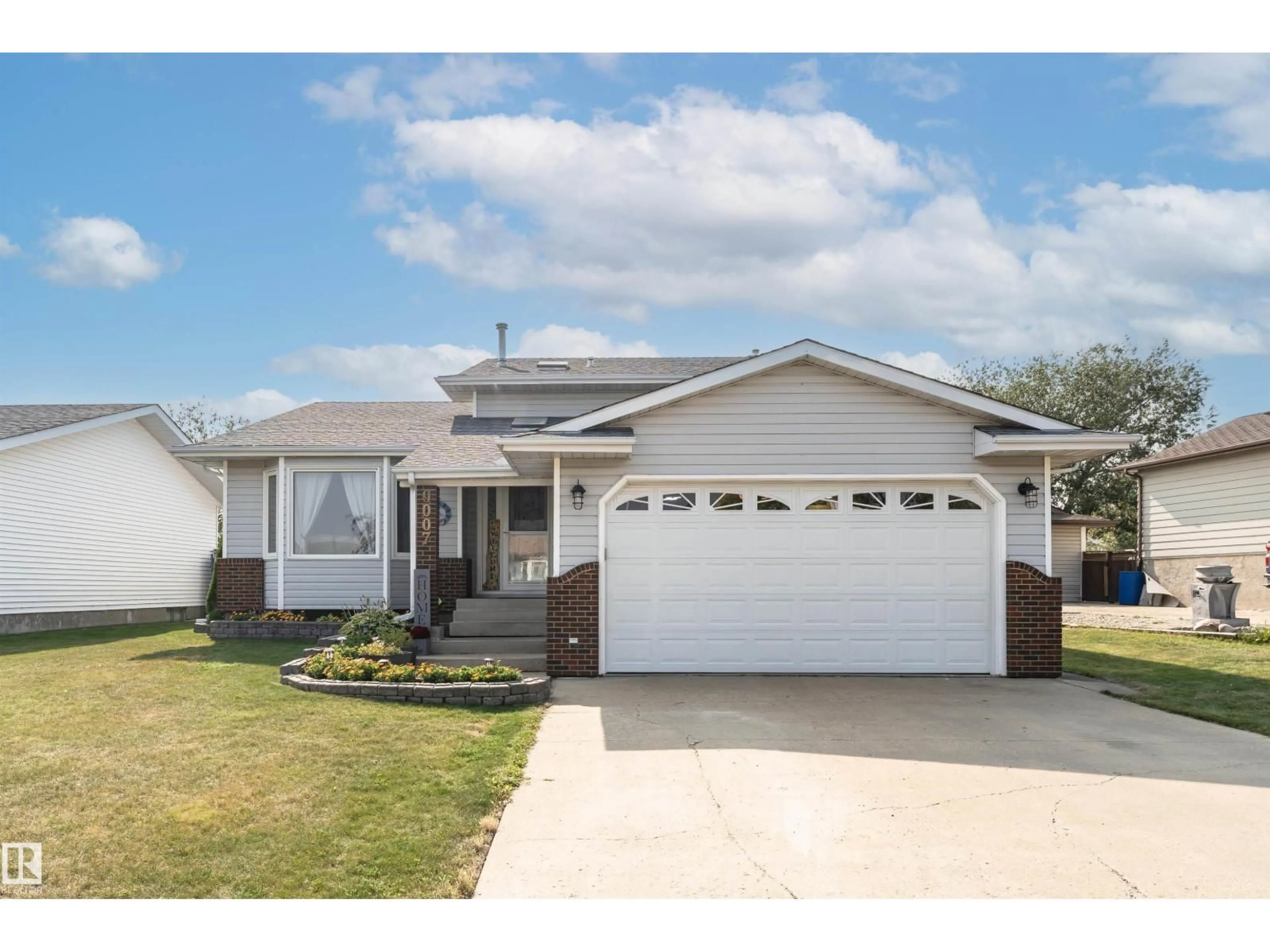 Home with vinyl exterior material, street for 9007 102 AV, Morinville Alberta T8R1B5