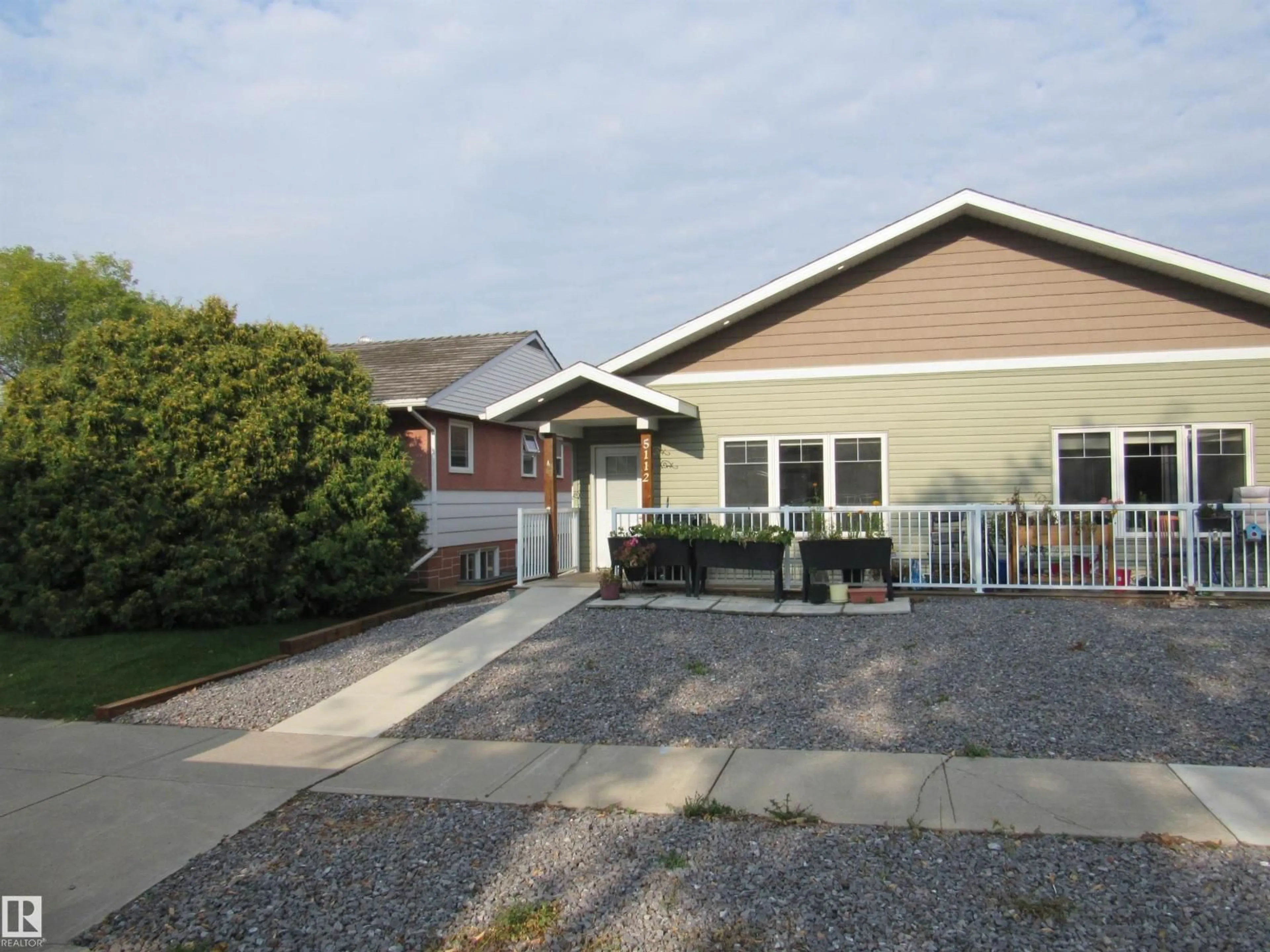 Home with vinyl exterior material, street for 5112 54 STREET, Barrhead Alberta T7N1E7