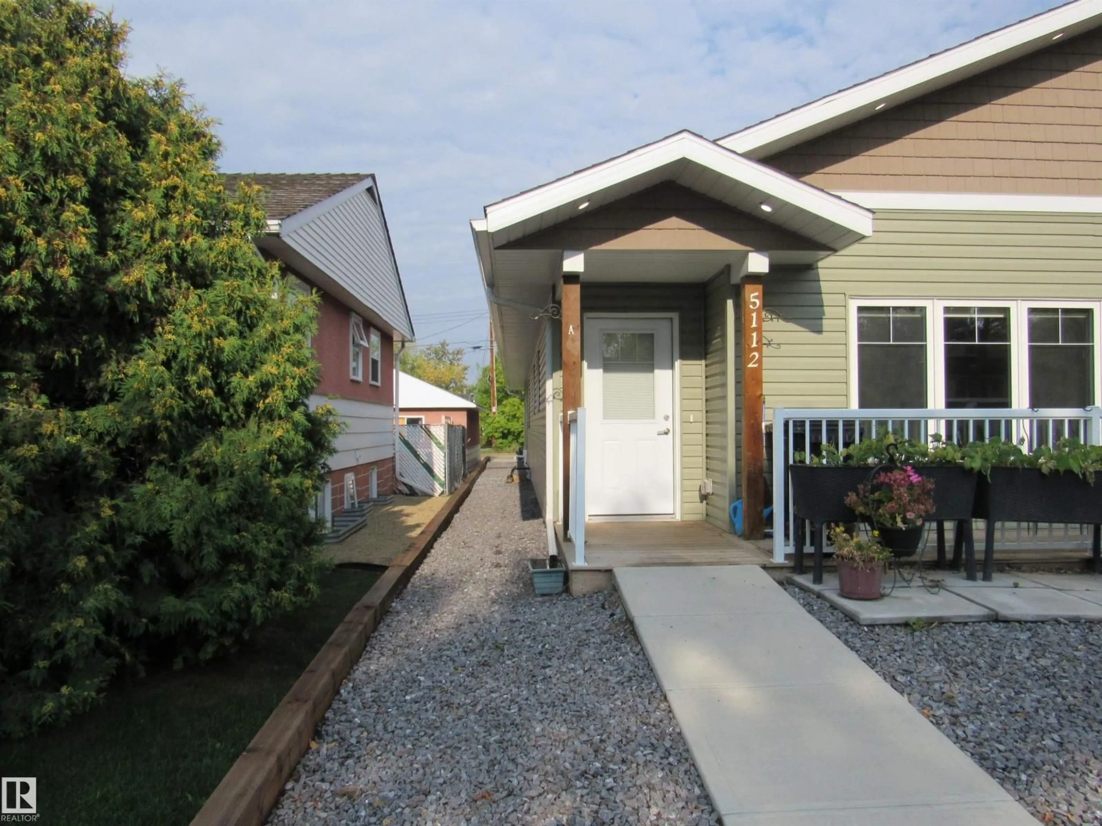Home with vinyl exterior material, street for 5112 54 STREET, Barrhead Alberta T7N1E7