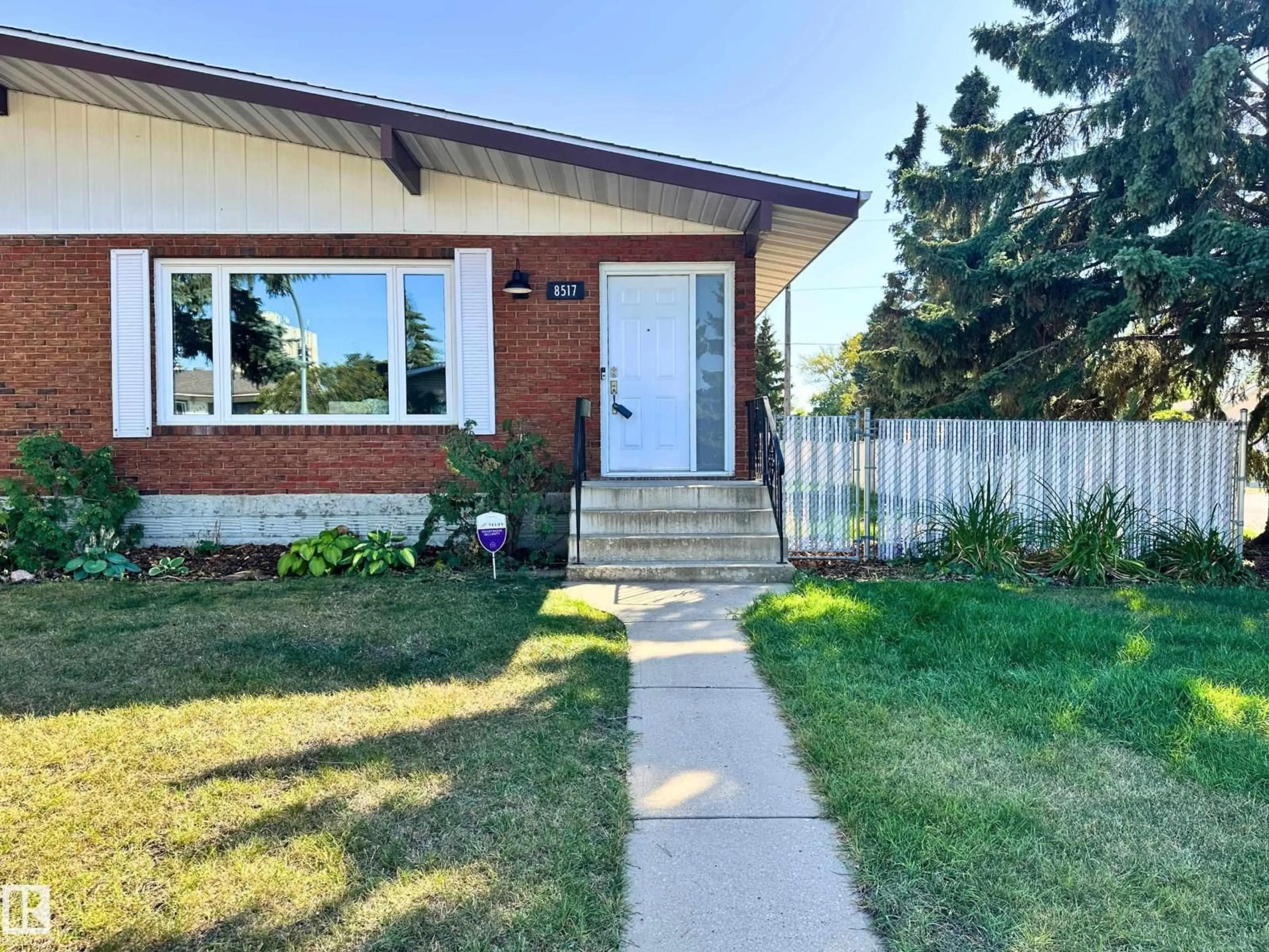 Home with brick exterior material, street for 8517 86 AV, Edmonton Alberta T6C1J4