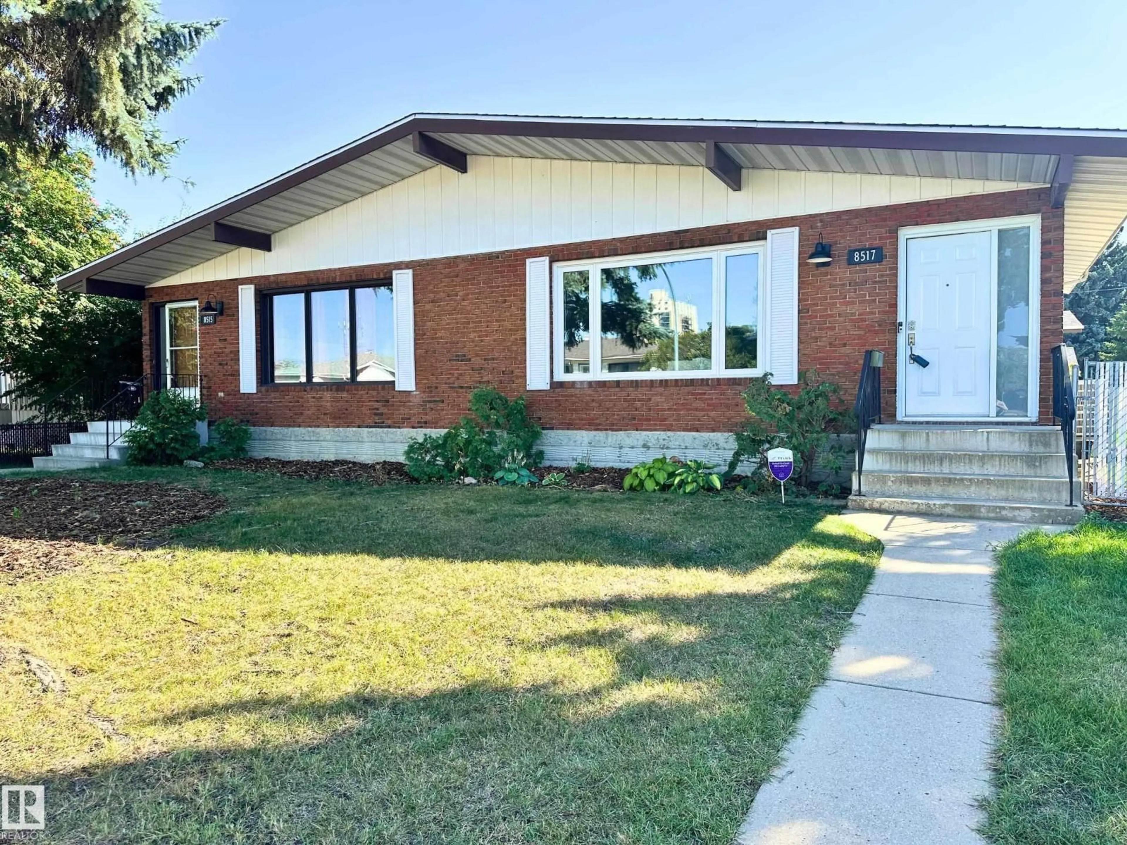 Home with brick exterior material, street for 8517 86 AV, Edmonton Alberta T6C1J4