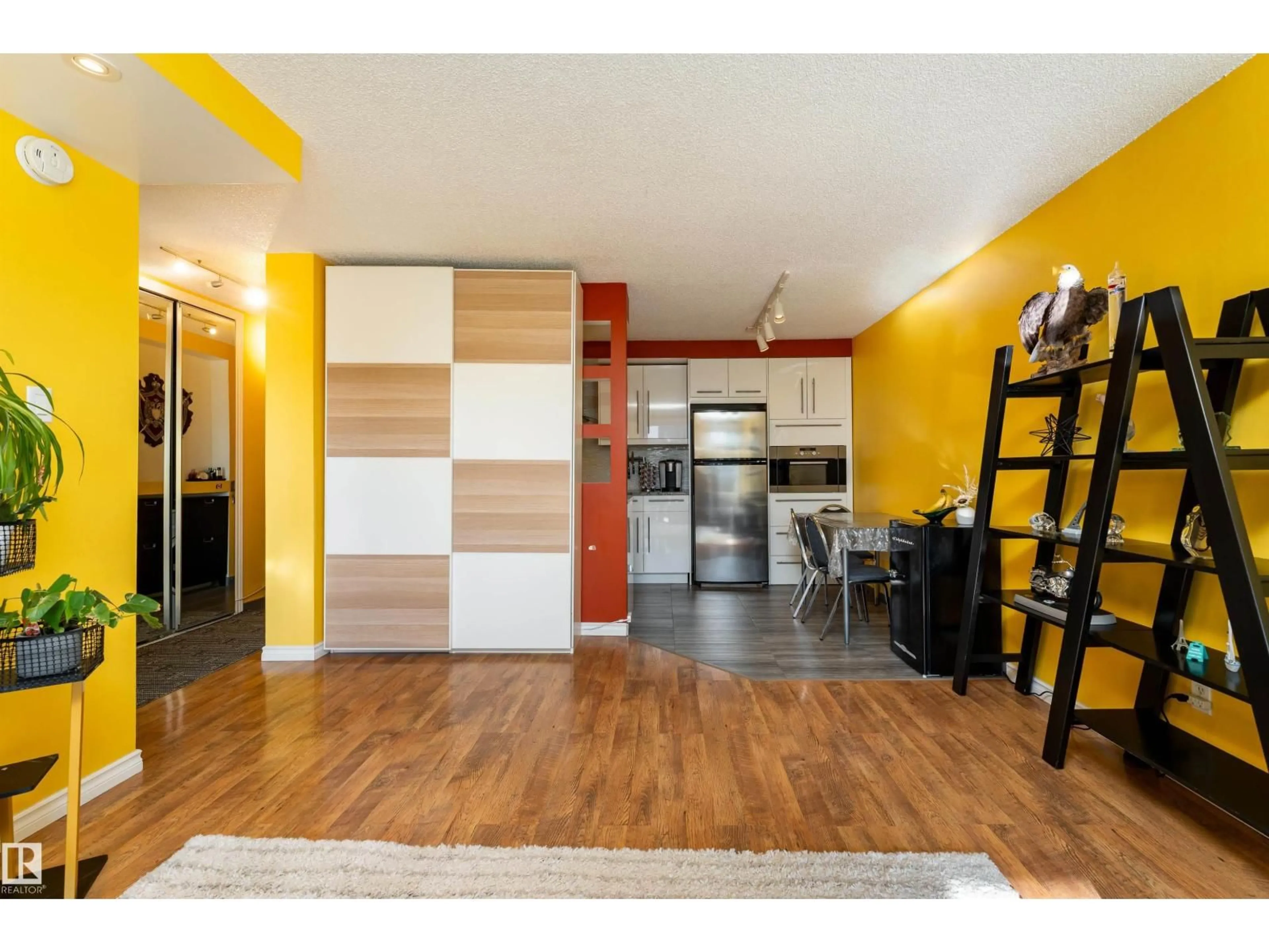 Open concept kitchen, wood/laminate floor for 9028 JASPER AV, Edmonton Alberta T5H3Y6