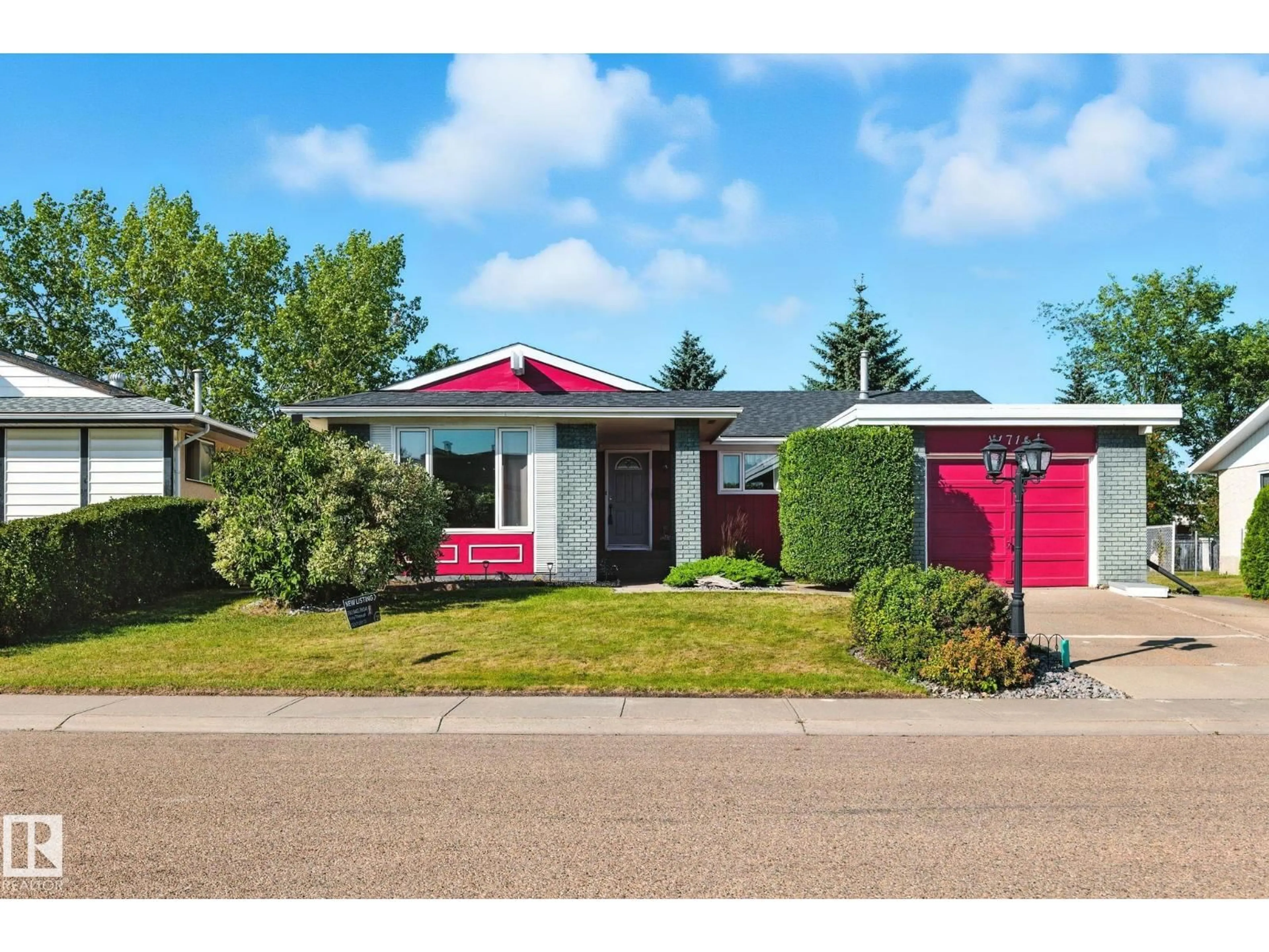Home with vinyl exterior material, street for 11716 148 AV, Edmonton Alberta T5X1B6