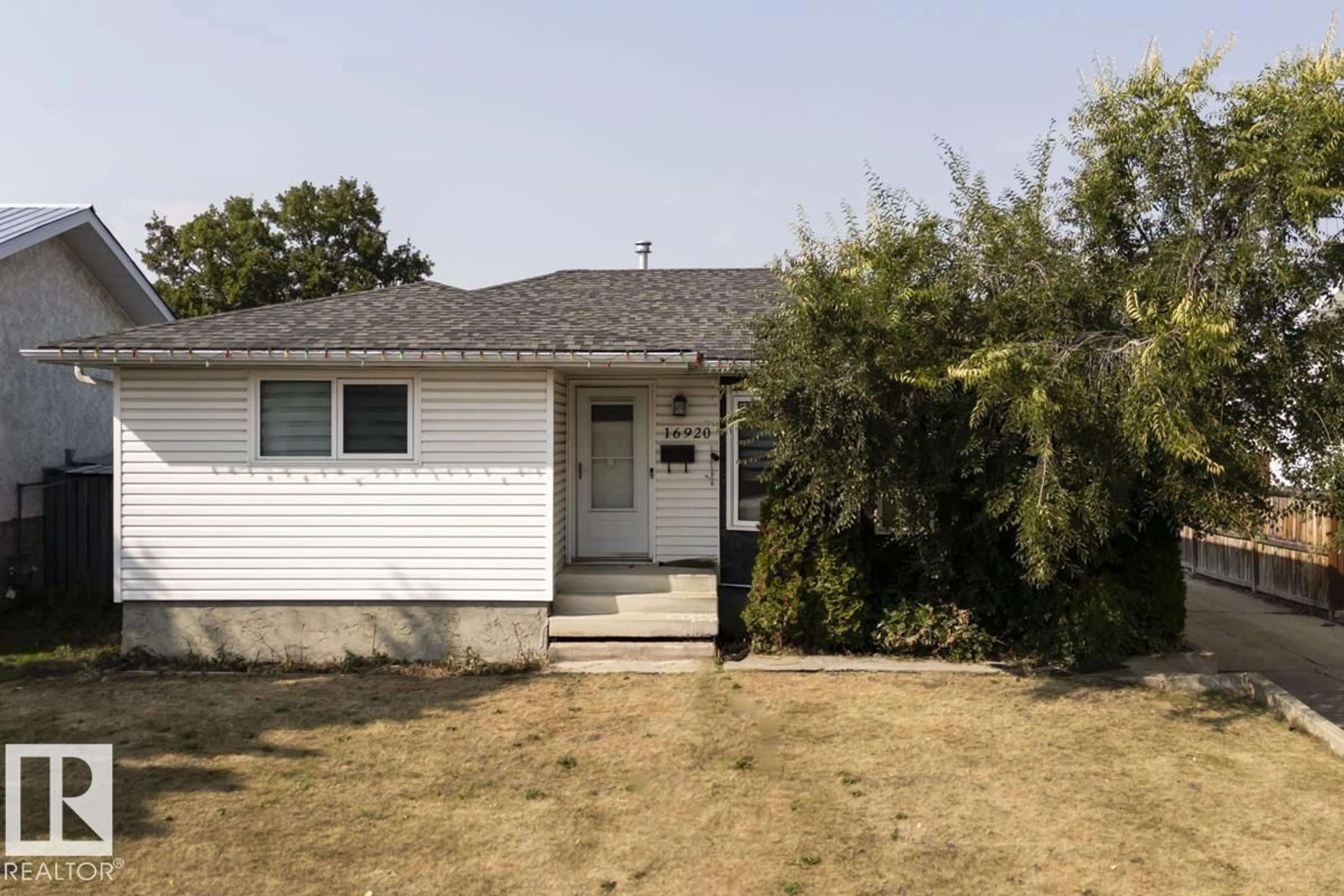 Home with vinyl exterior material, street for 16920 110 ST, Edmonton Alberta T5X2N8