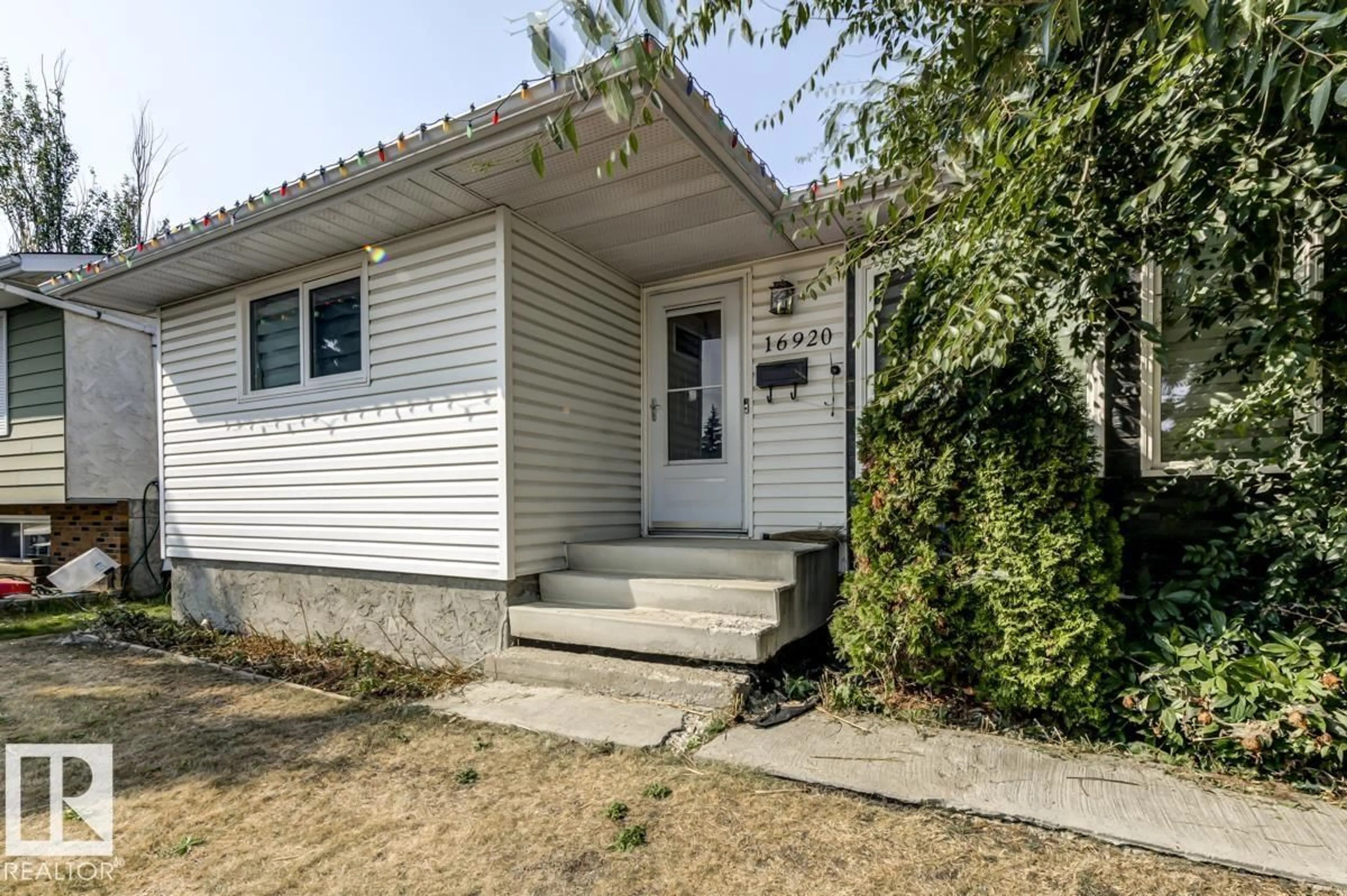 Home with vinyl exterior material, street for 16920 110 ST, Edmonton Alberta T5X2N8