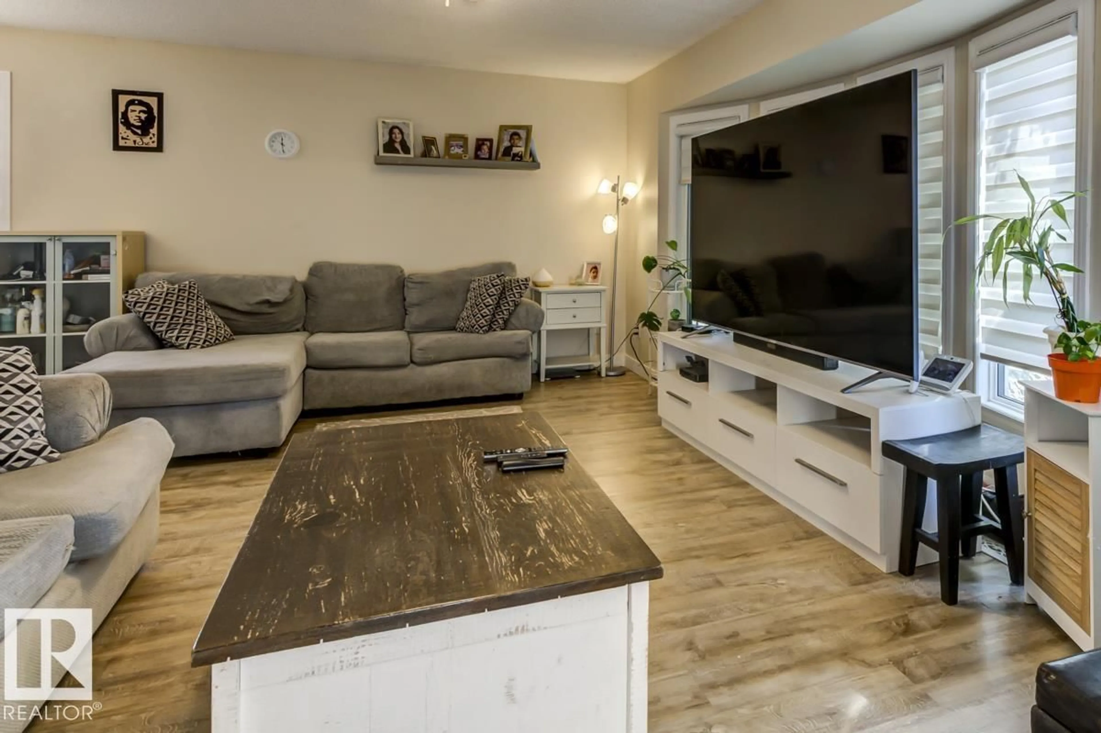 Living room with furniture, wood/laminate floor for 16920 110 ST, Edmonton Alberta T5X2N8
