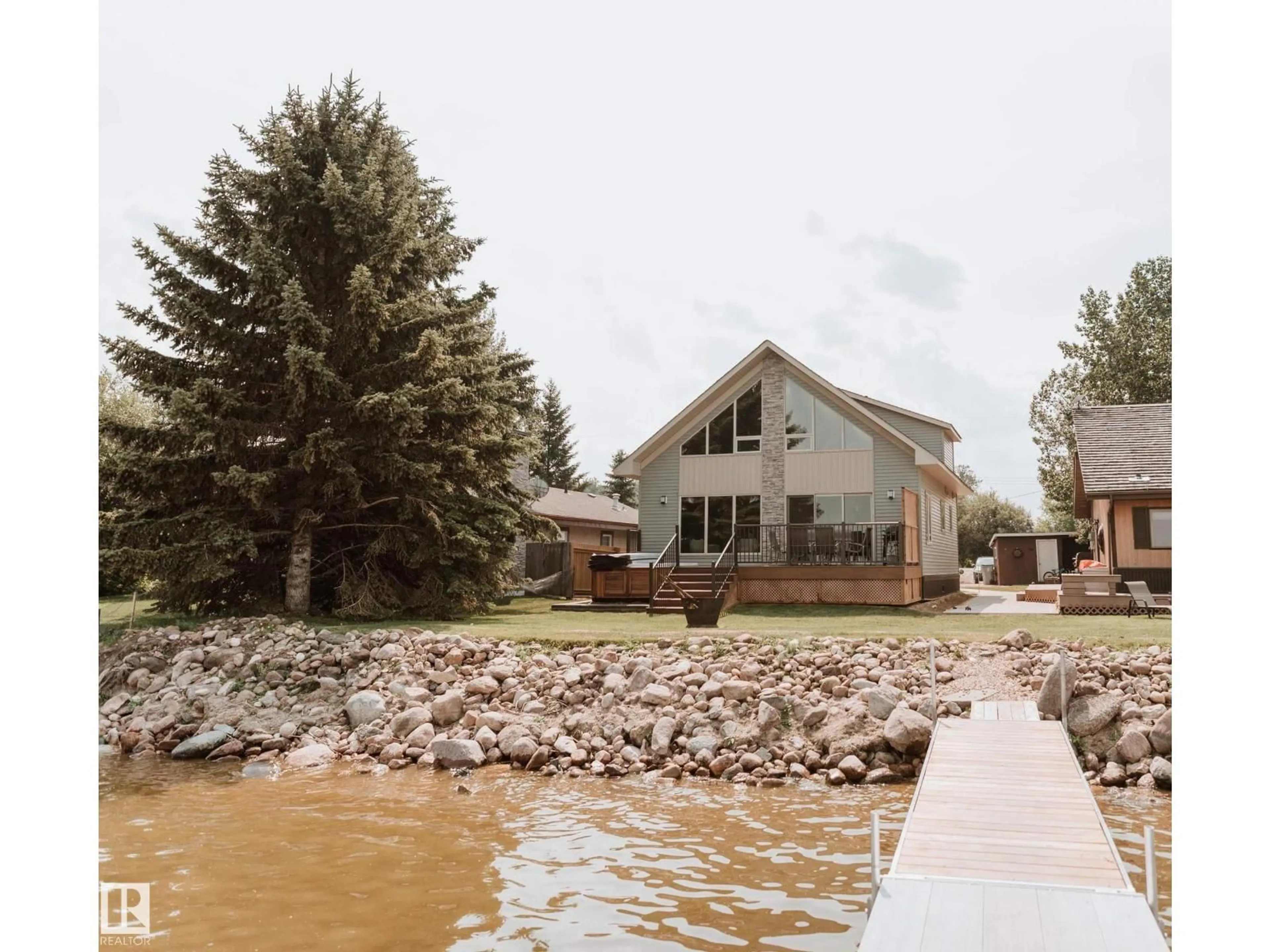 Home with vinyl exterior material, water/lake/river/ocean view for 33 LAKESHORE DR, Rural Wetaskiwin County Alberta T0C2V0