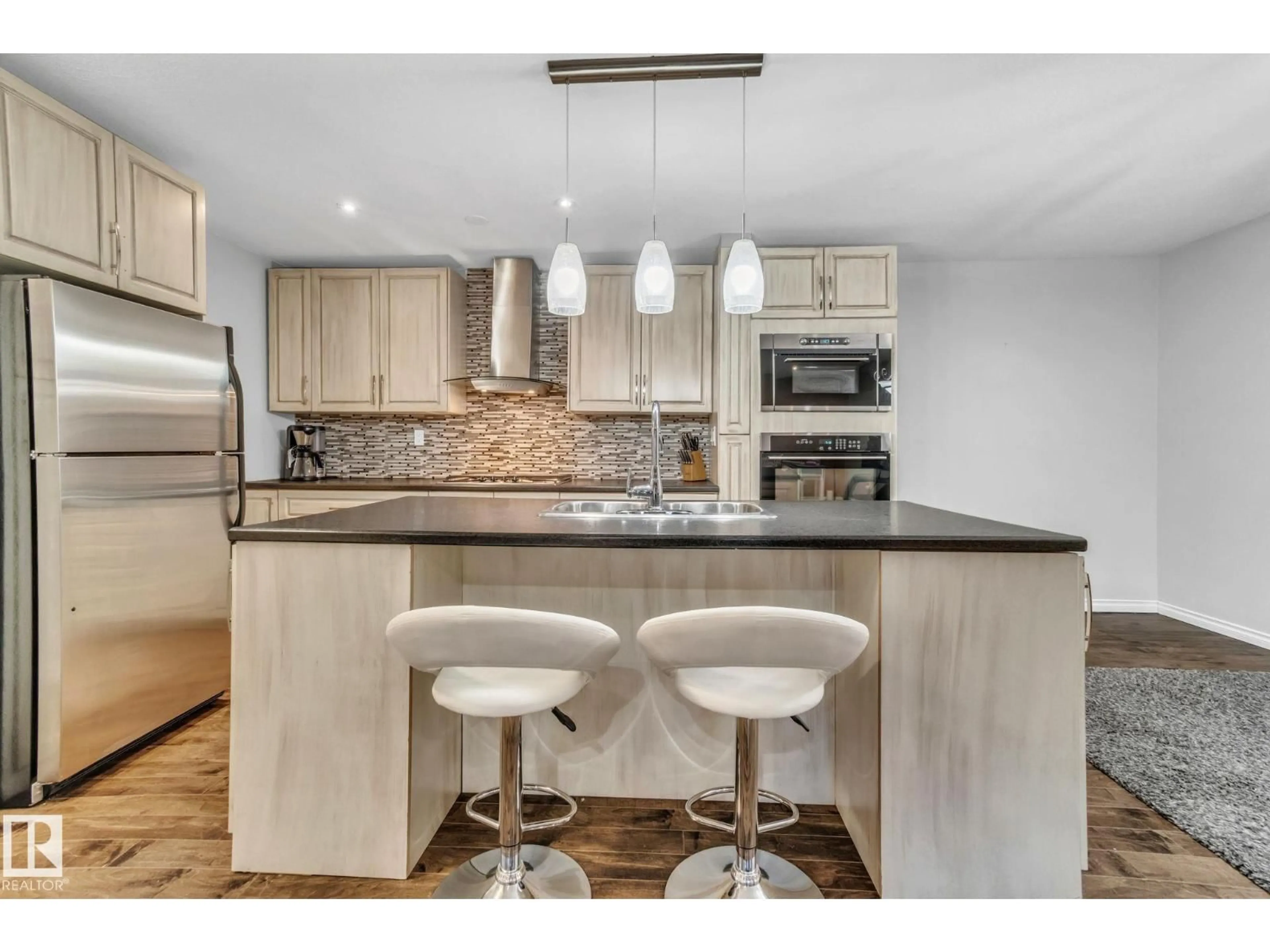 Open concept kitchen, wood/laminate floor for NW - 5758 172 ST, Edmonton Alberta T6M1B4