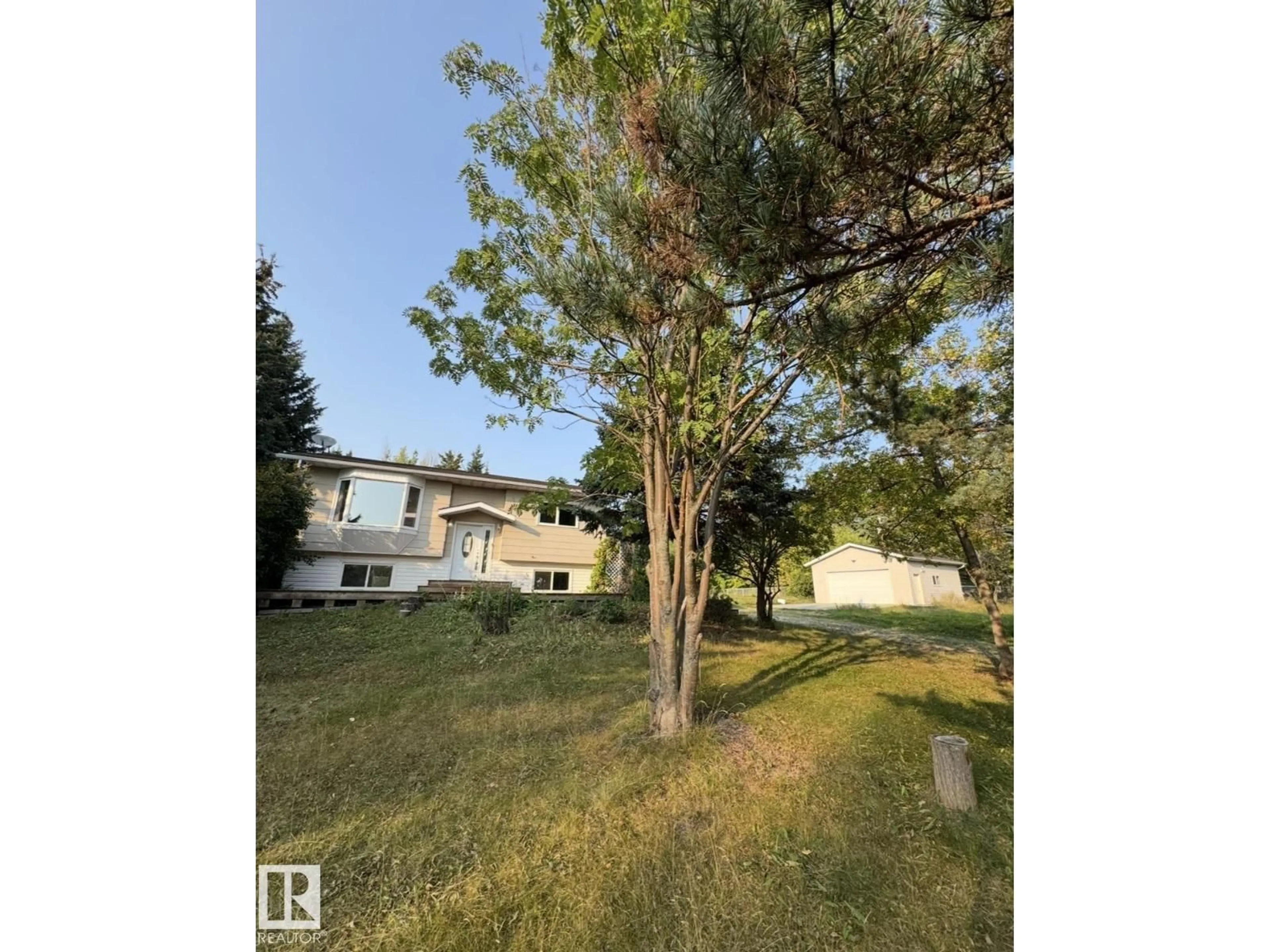 A pic from outside/outdoor area/front of a property/back of a property/a pic from drone, unknown for #22 - 53212 RANGE ROAD 15, Rural Parkland County Alberta T5Y0C3