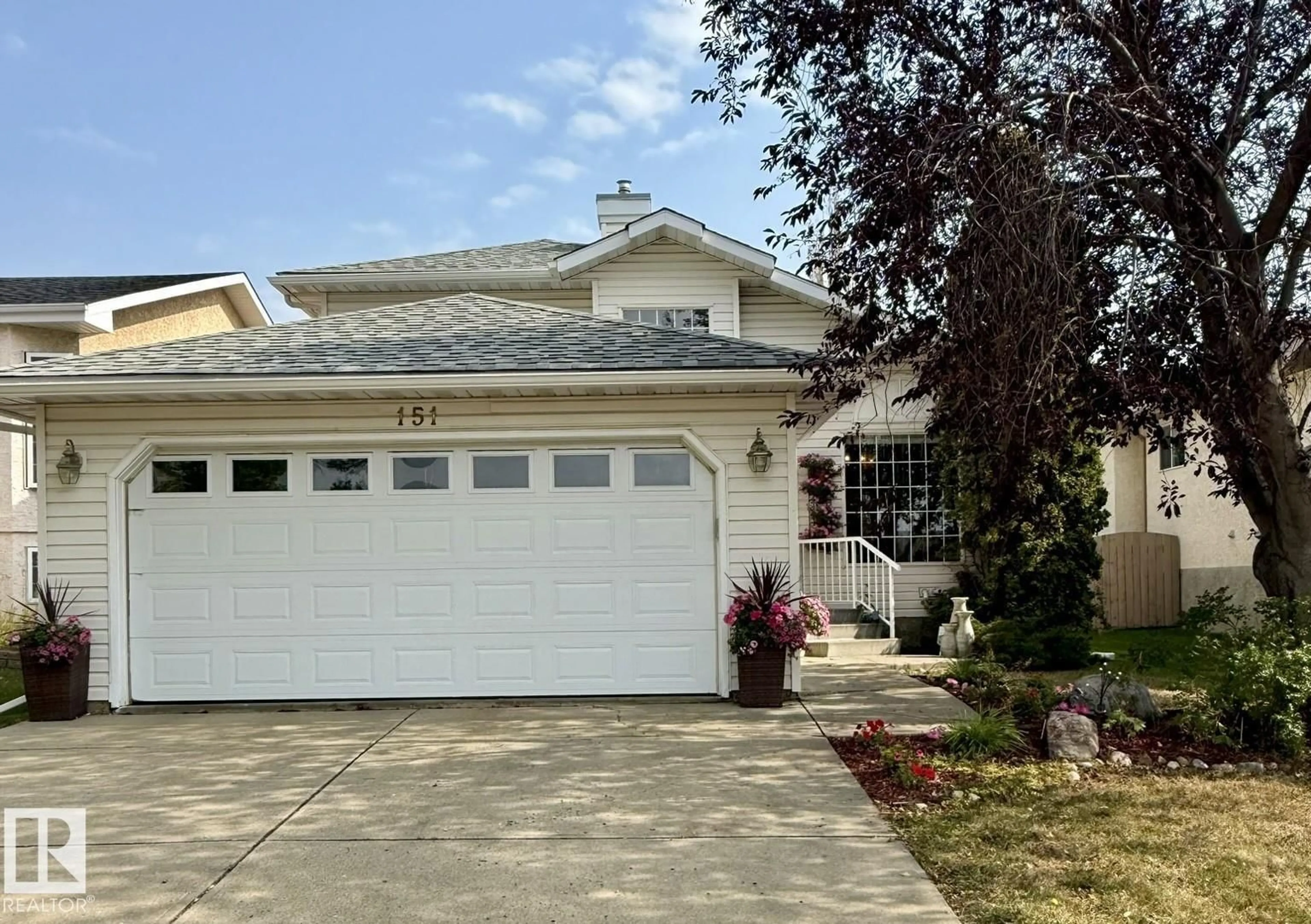 Home with vinyl exterior material, street for 151 DUNVEGAN RD, Edmonton Alberta T5L5A7