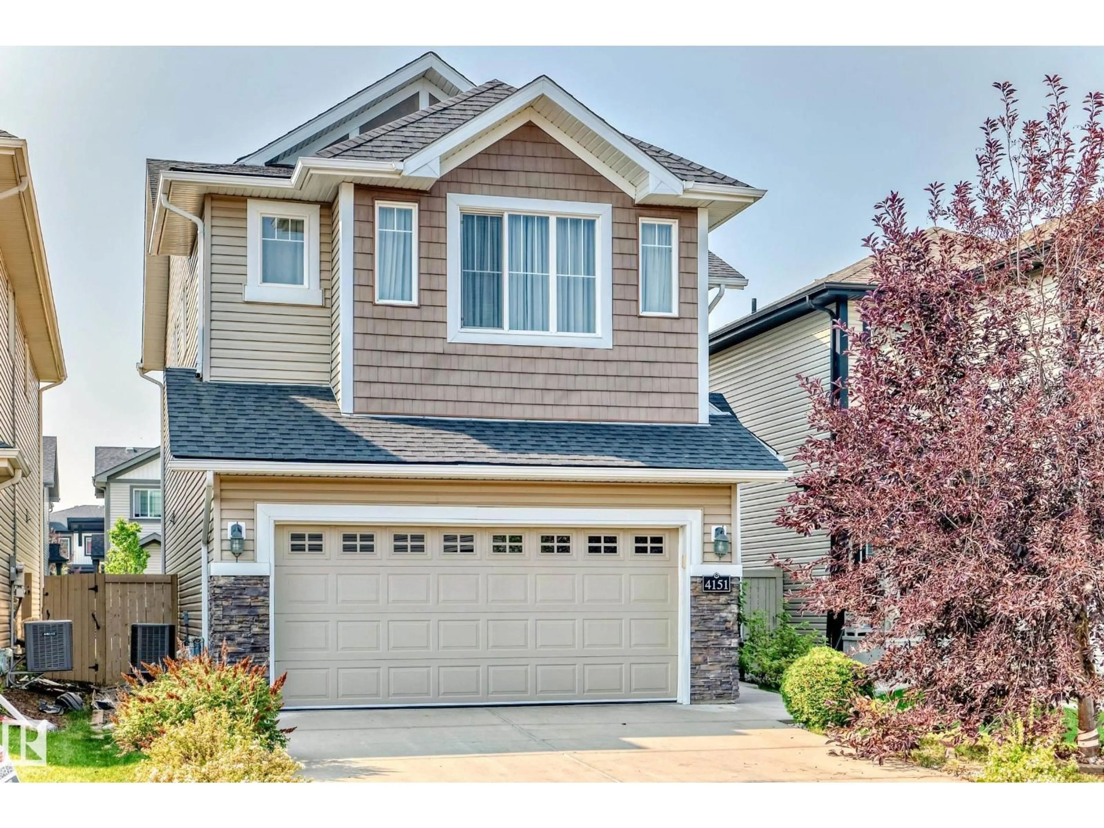 Home with vinyl exterior material, street for 4151 ALEXANDER WY, Edmonton Alberta T6W2C8