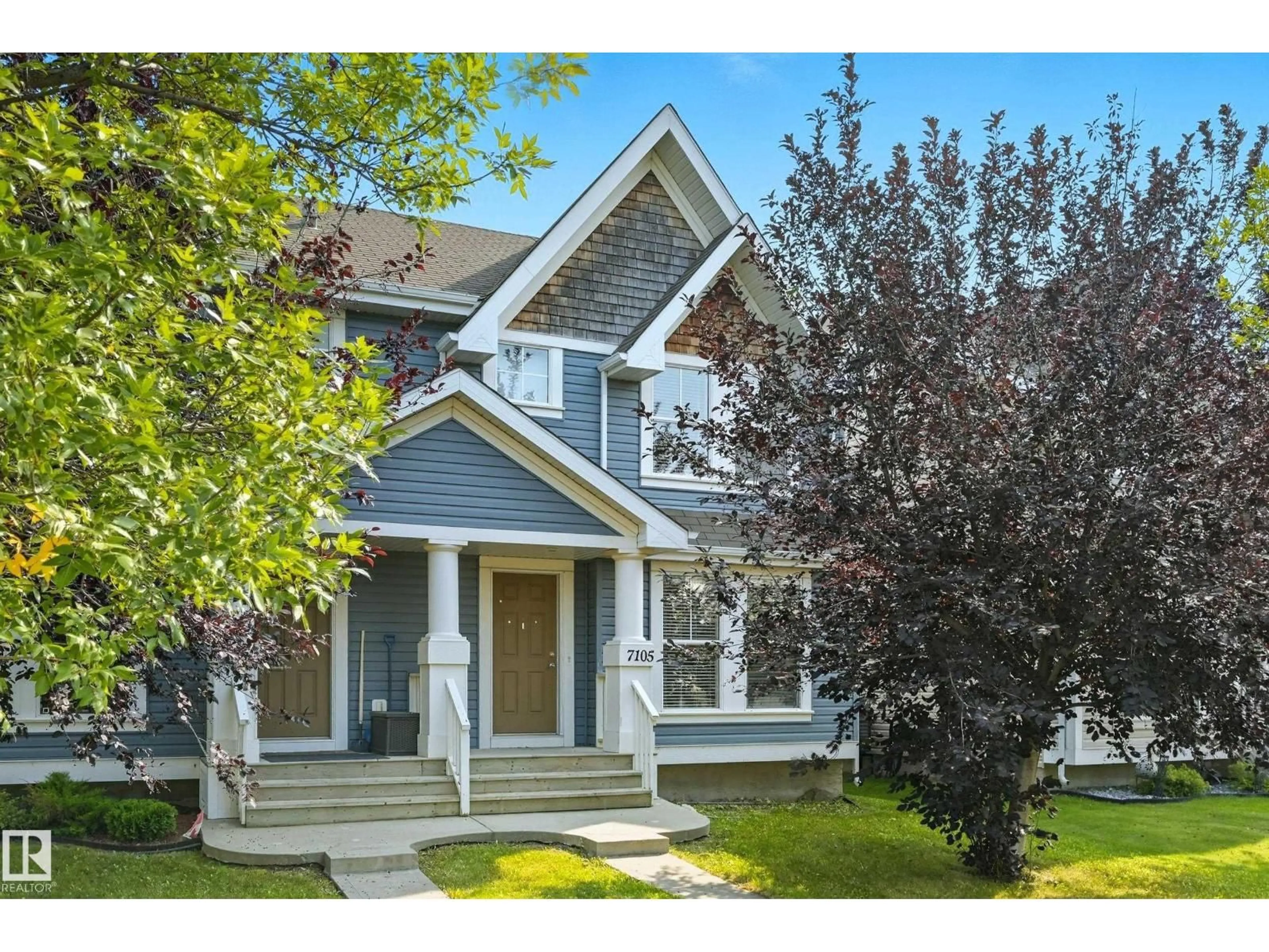 Home with vinyl exterior material, street for SW - 7105 21 AV, Edmonton Alberta T6X0K1