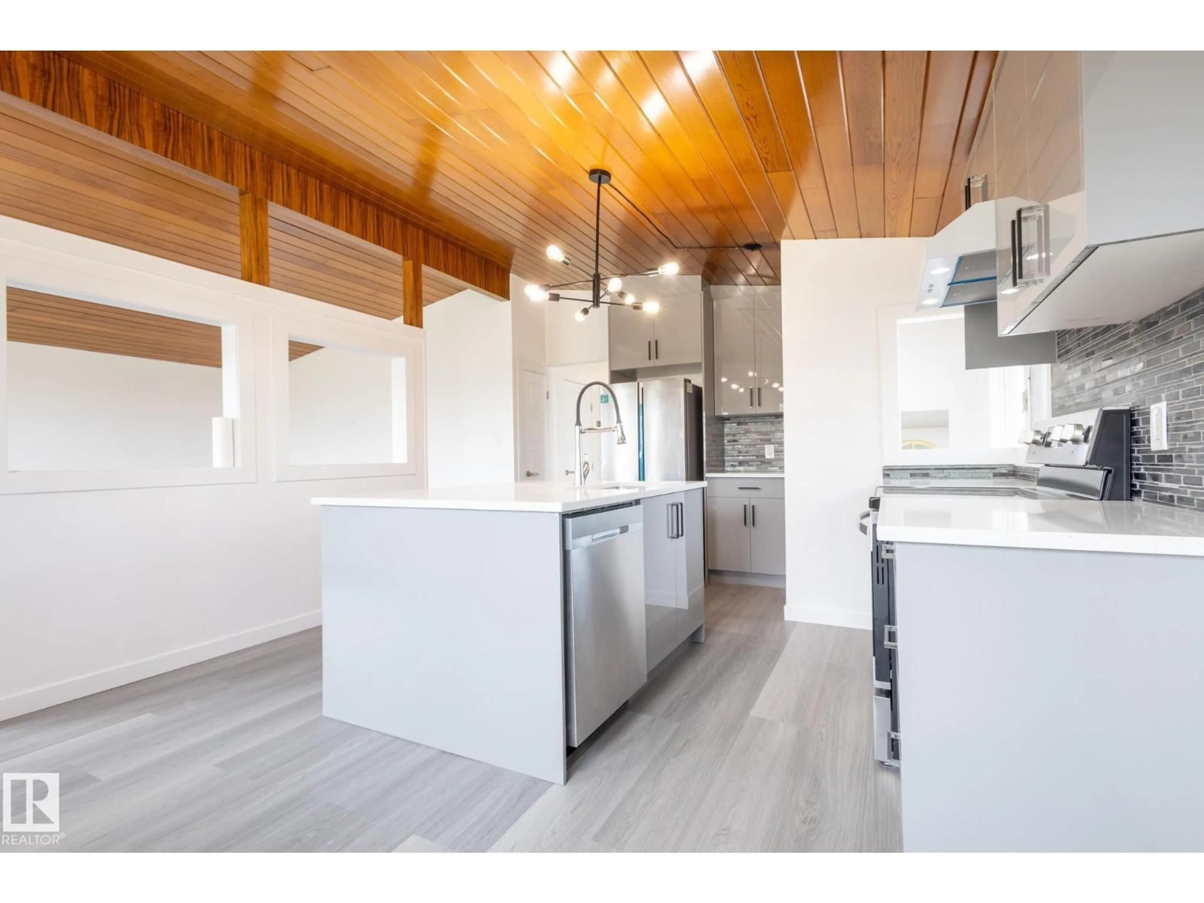 Open concept kitchen, wood/laminate floor for NW - 13340 94 ST, Edmonton Alberta T5E3V8