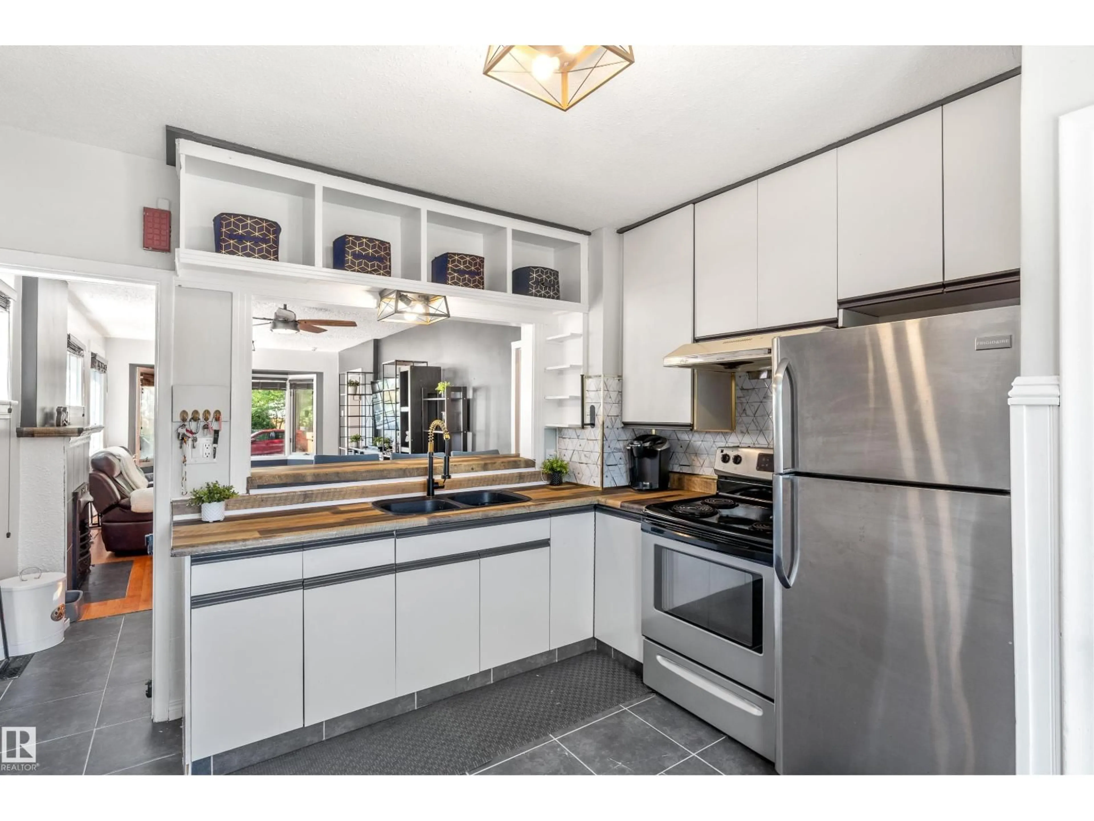 Open concept kitchen, ceramic/tile floor for 11711 94 ST, Edmonton Alberta T5G1J1