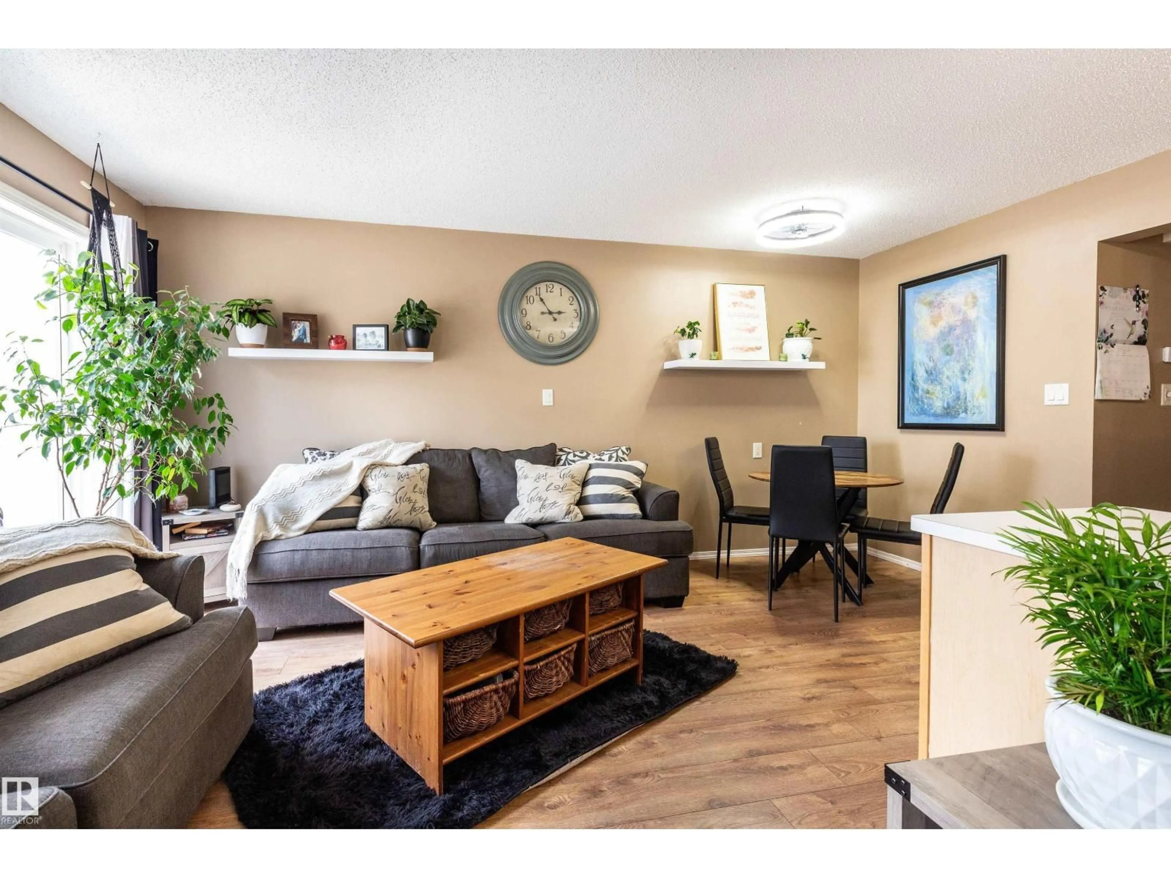 Living room with furniture, wood/laminate floor for #45 - 451 HYNDMAN CR, Edmonton Alberta T5A5J3
