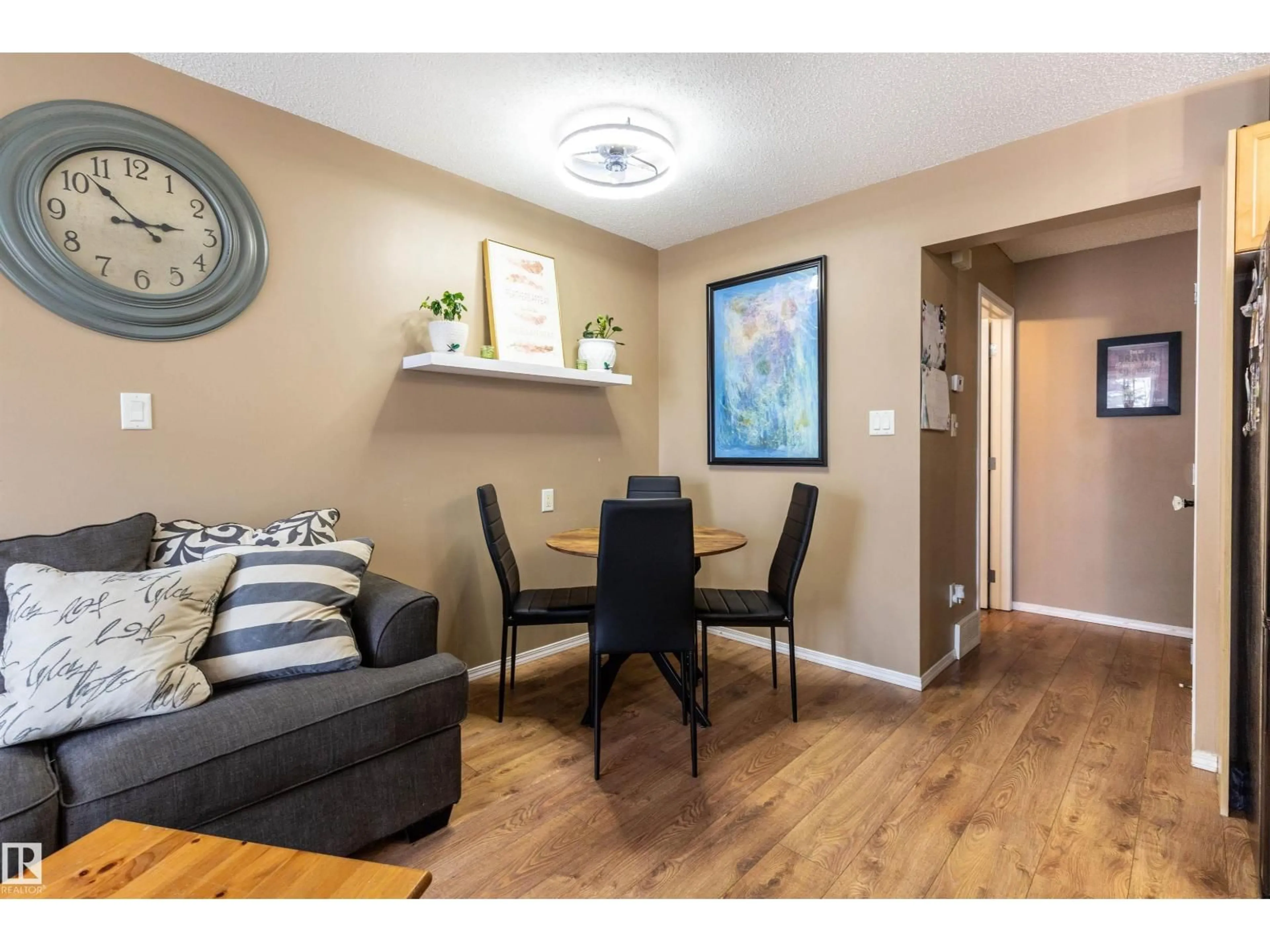 Living room with furniture, wood/laminate floor for #45 - 451 HYNDMAN CR, Edmonton Alberta T5A5J3